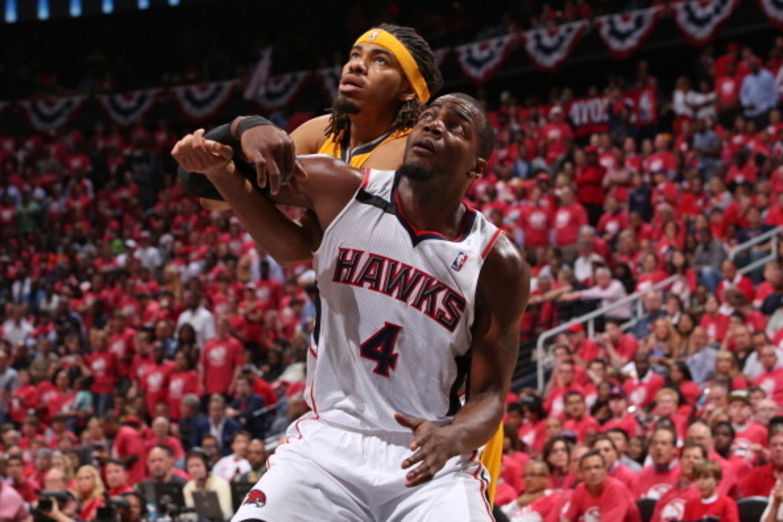 ATLANTA, GA - MAY 1:  Paul Millsap #4 of the Atlanta Hawks boxes out Chris Copeland #22 of the Indiana Pacers during Game Six of the Eastern Conference Quarterfinals on May 1, 2014 at Philips Arena in Atlanta, Georgia.  NOTE TO USER: User expressly acknow