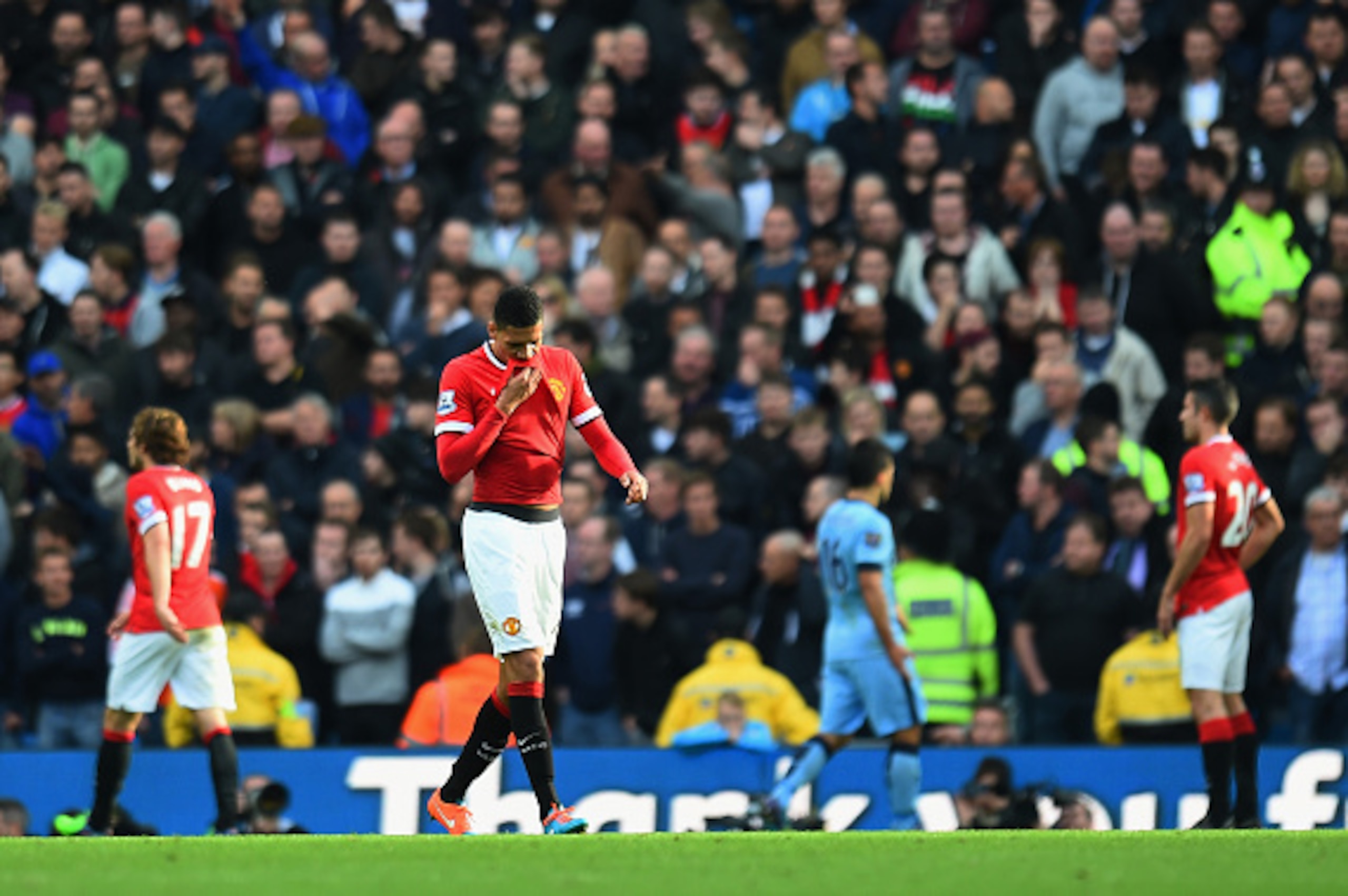 MANCHESTER, ENGLAND - NOVEMBER 02:  Chris Smalling of Manchester United leaves the field after receiving a red card during the Barclays Premier League match between Manchester City and Manchester United at Etihad Stadium on November 2, 2014 in Manchester,
