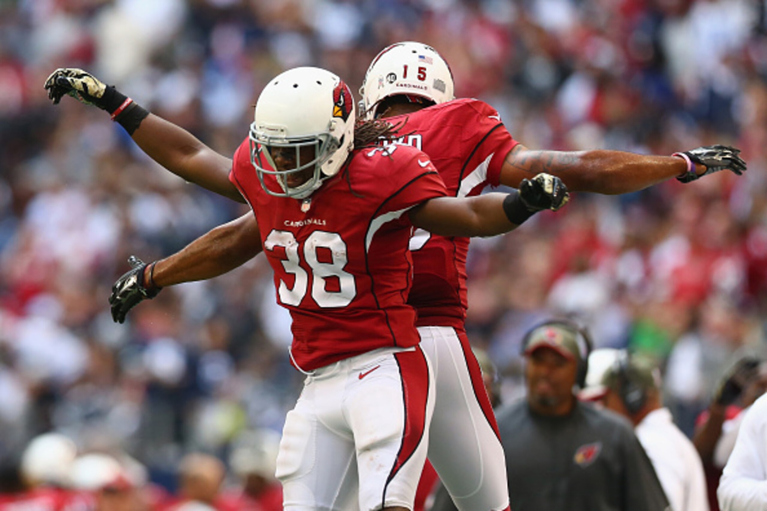 ARLINGTON, TX - NOVEMBER 02:  Andre Ellington #38 of the Arizona Cardinals celebrates his touchdown with Michael Floyd #15 against the Dallas Cowboys in the fourth quarter at AT&T Stadium on November 2, 2014 in Arlington, Texas.  (Photo by Ronald Martinez