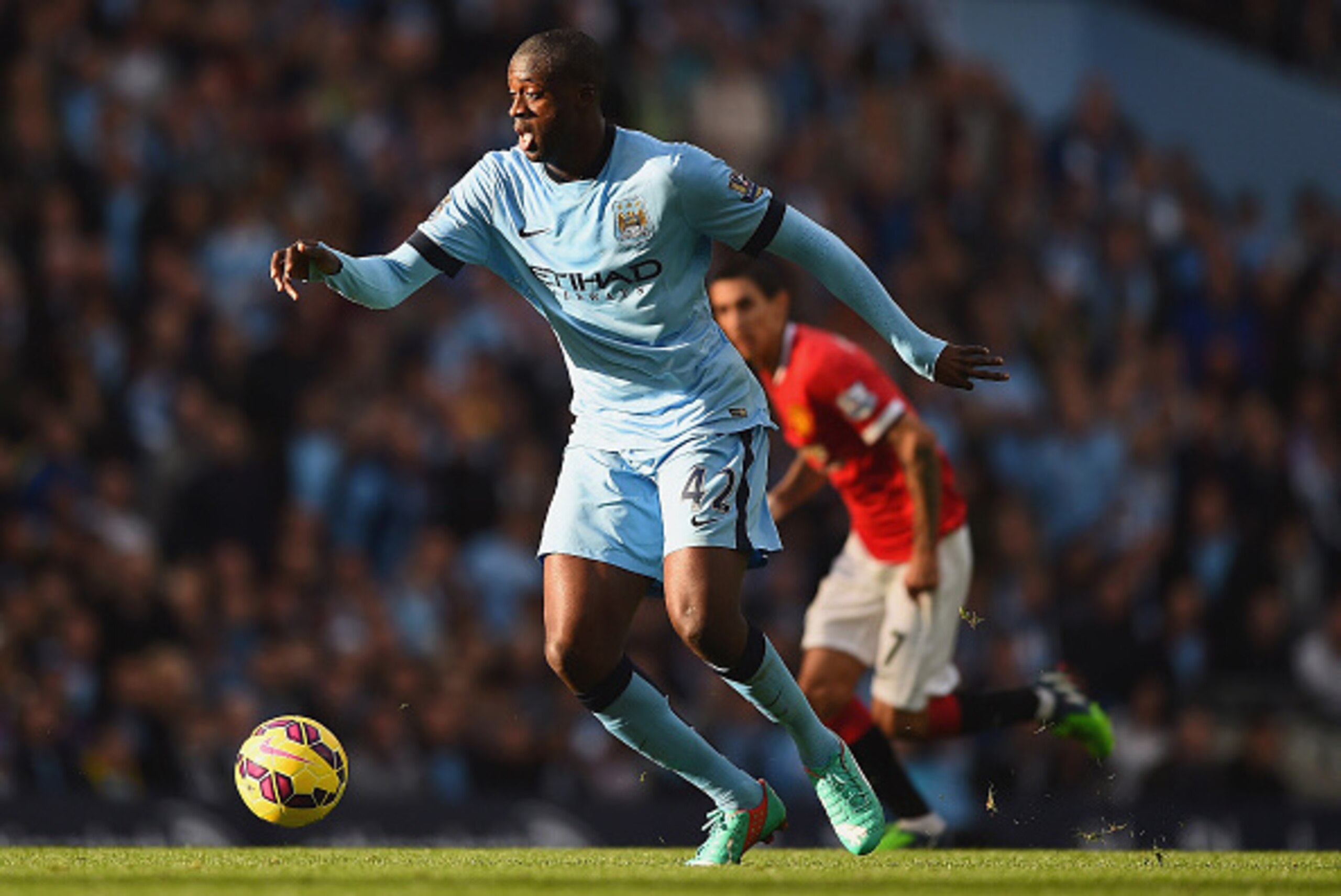 MANCHESTER, ENGLAND - NOVEMBER 02: Yaya Toure of Manchester City on the ball during the Barclays Premier League match between Manchester City and Manchester United at Etihad Stadium on November 2, 2014 in Manchester, England.  (Photo by Laurence Griffiths