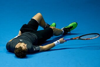 VALENCIA, SPAIN - OCTOBER 26:  Andy Murray of Great Britain falls over in his match against Tommy Robredo of Spain in the final during day seven of the ATP 500 World Tour Valencia Open tennis tournament at the Ciudad de las Artes y las Ciencias on October