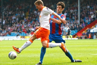 LONDON, ENGLAND - AUGUST 27: Mile Jedinak of Crystal Palace and Billy Clarke of Blackpool in action during the npower Championship match between Crystal Palace and Blackpool at Selhurst Park on August 27, 2011 in London, England. (Photo by Tom Dulat/Getty
