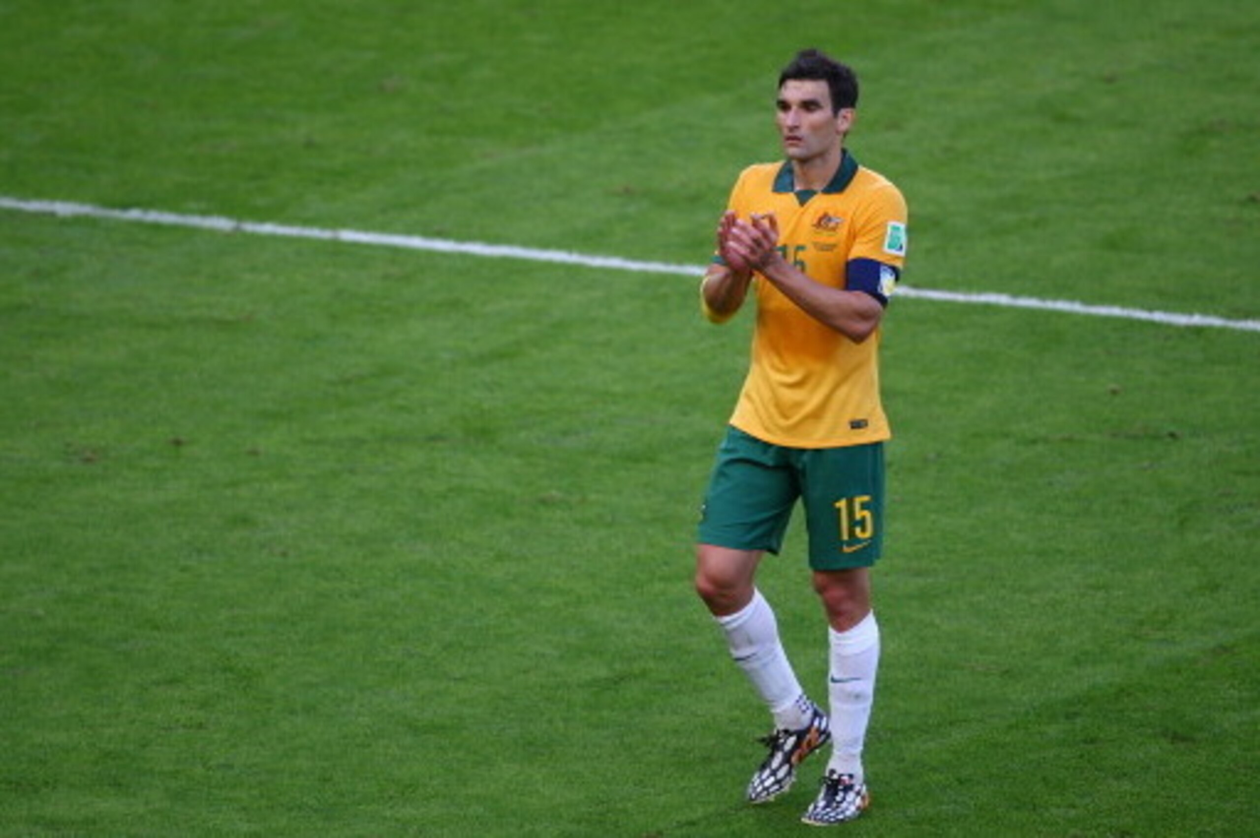 PORTO ALEGRE, BRAZIL - JUNE 18: Mile Jedinak of Australia acknowledges the fans after his teams 3-2 defeat to the Netherlands in the 2014 FIFA World Cup Brazil Group B match between Australia and Netherlands at Estadio Beira-Rio on June 18, 2014 in Porto PORTO ALEGRE, BRAZIL - JUNE 18: Mile Jedinak of Australia acknowledges the fans after his teams 3-2 defeat to the Netherlands in the 2014 FIFA World Cup Brazil Group B match between Australia and Netherlands at Estadio Beira-Rio on June 18, 2014 in Porto