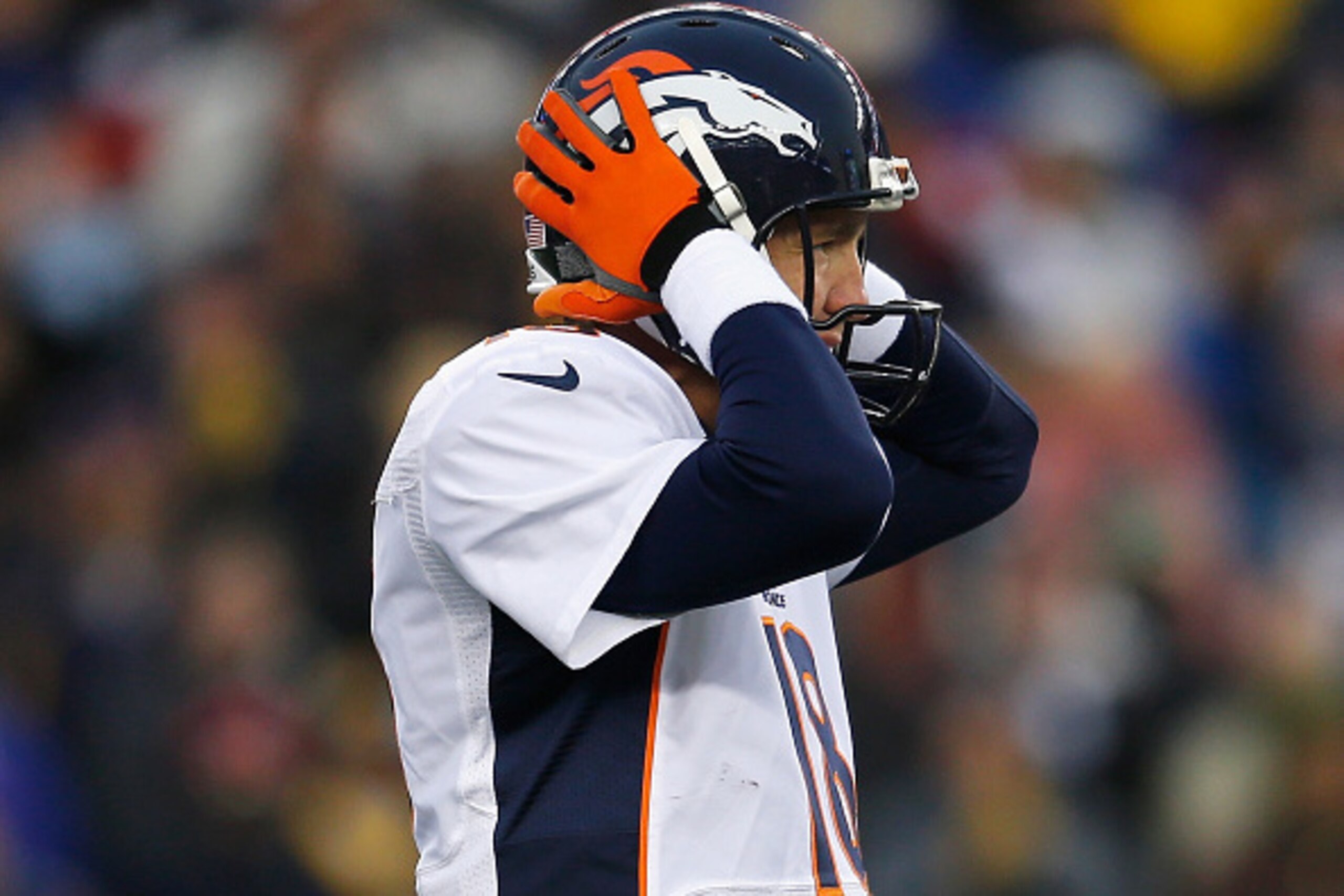 FOXBORO, MA - NOVEMBER 02:  Peyton Manning #18 of the Denver Broncos reacts during the first quarter against the New England Patriots at Gillette Stadium on November 2, 2014 in Foxboro, Massachusetts.  (Photo by Jim Rogash/Getty Images)