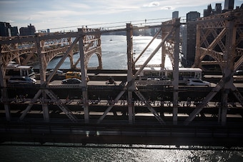 NEW YORK, NY - NOVEMBER 02:  Runners cross the 59th Street Bridge as seen from the Roosevelt Island tramway during the TCS New York City Marathon on November 2, 2014 inof New York City.  (Photo by Andrew Burton/Getty Images)