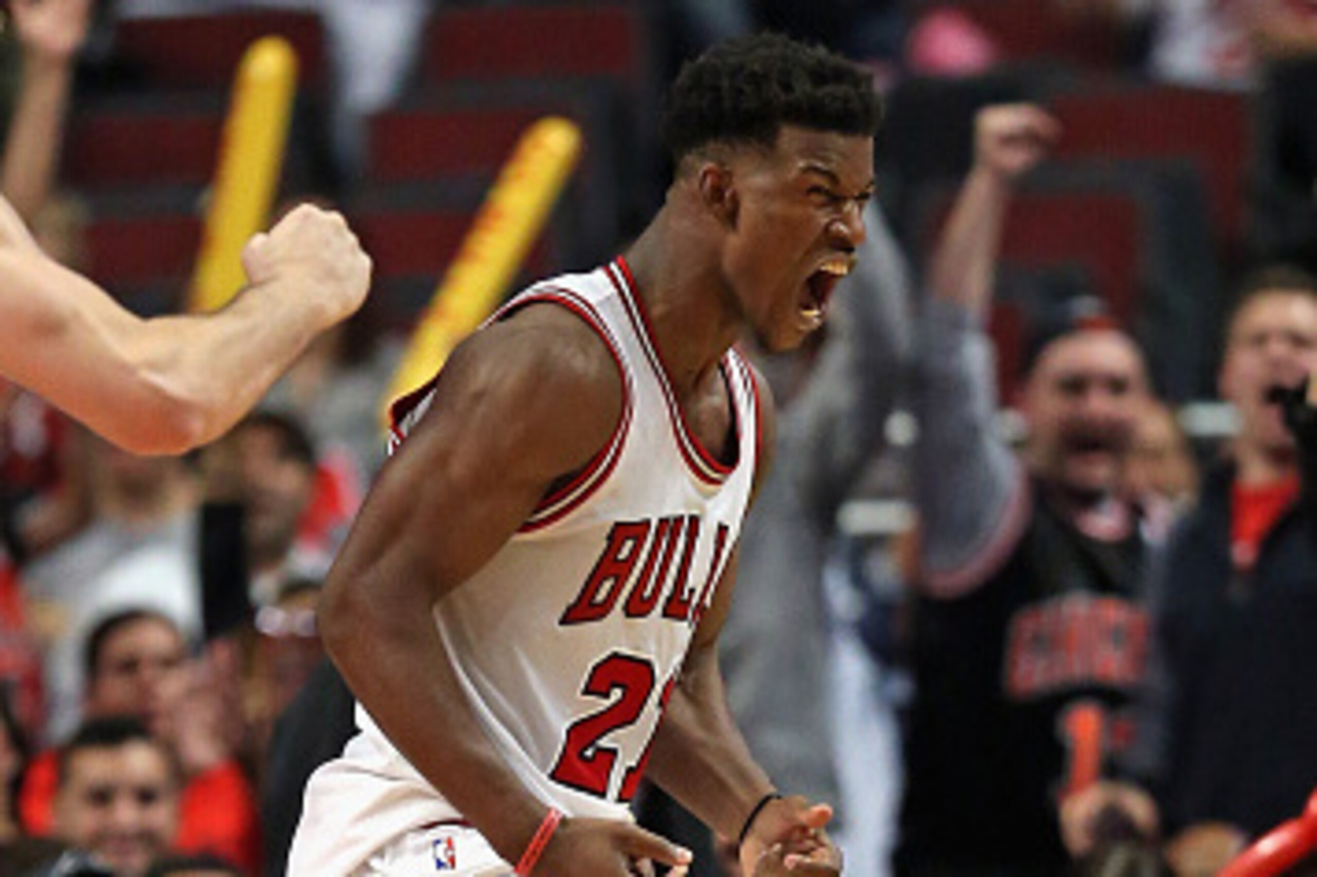 CHICAGO, IL - OCTOBER 16: Jimmy Butler #21 of the Chicago Bulls celebrates a three-point play against the Atlanra Hawks during a preseason game at the United Center on October 16, 2014 in Chicago, Illinois. The Bulls defeated the Hawks 85-84. NOTE TO USER