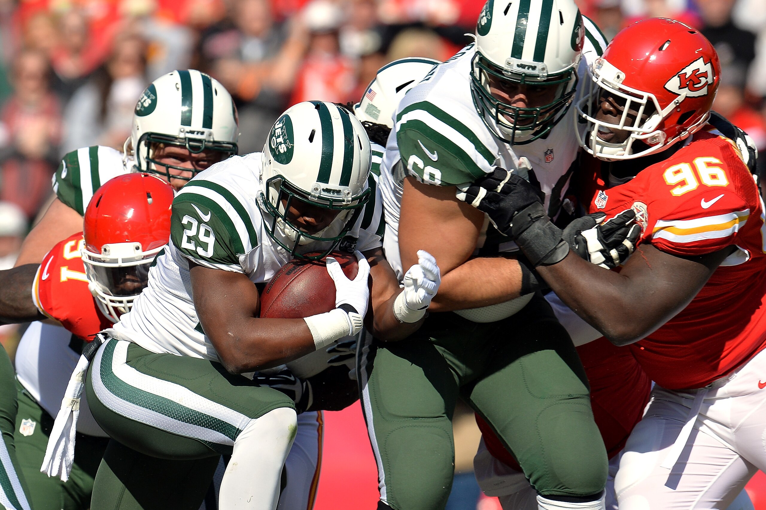 KANSAS CITY, MO - NOVEMBER 02:   Bilal Powell #29 of the New York Jets fights for yardage against the Kansas City Chiefs during the first half at Arrowhead Stadium on November 2, 2014 in Kansas City, Missouri.  (Photo by Peter Aiken/Getty Images)