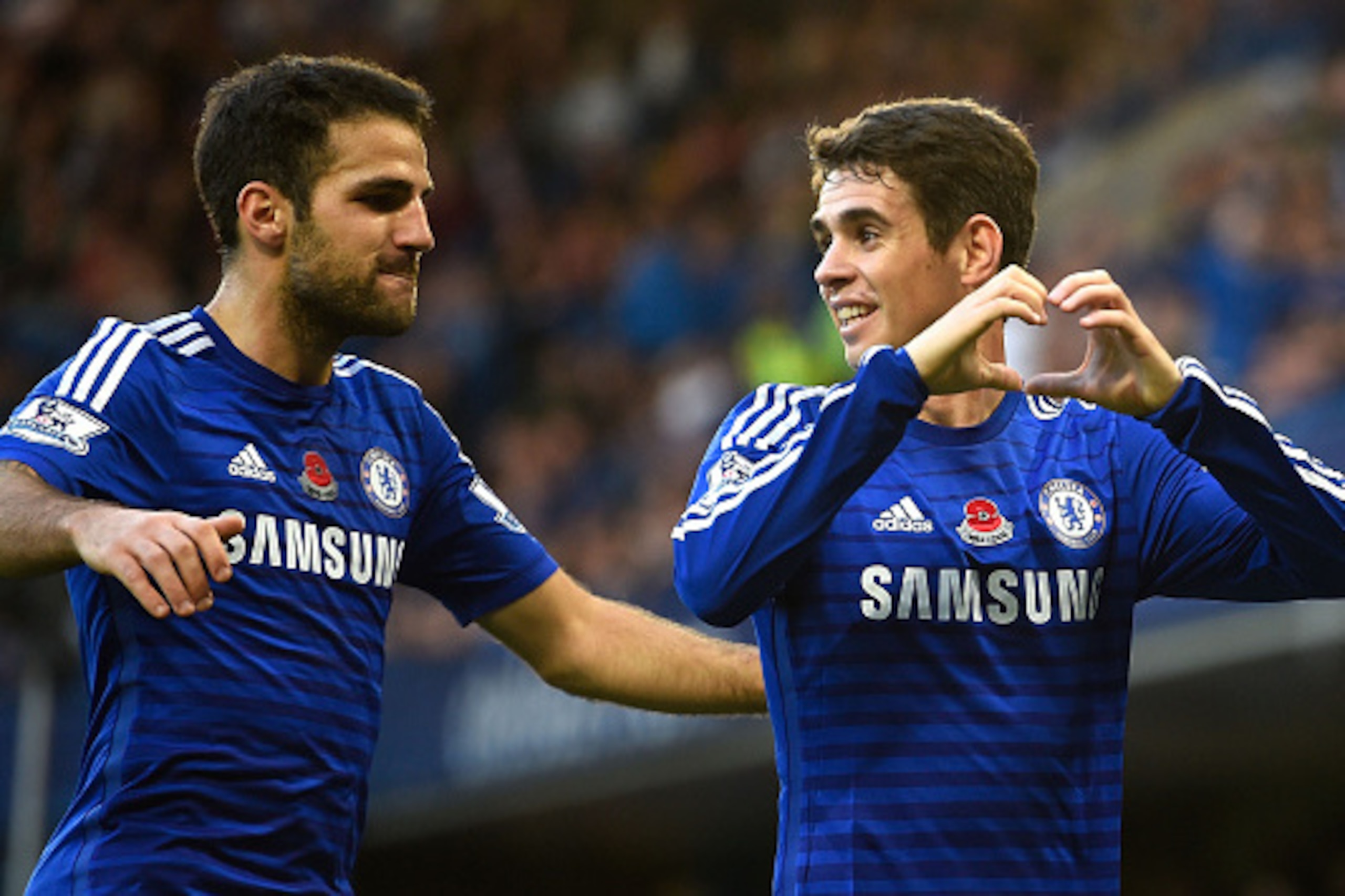 LONDON, ENGLAND - NOVEMBER 01: Oscar of Chelsea celebrates his goal with Cesc Fabregas during the Barclays Premier League match between Chelsea and Queens Park Rangers at Stamford Bridge on November 1, 2014 in London, England. (Photo by Mike Hewitt/Gett LONDON, ENGLAND - NOVEMBER 01: Oscar of Chelsea celebrates his goal with Cesc Fabregas during the Barclays Premier League match between Chelsea and Queens Park Rangers at Stamford Bridge on November 1, 2014 in London, England. (Photo by Mike Hewitt/Gett