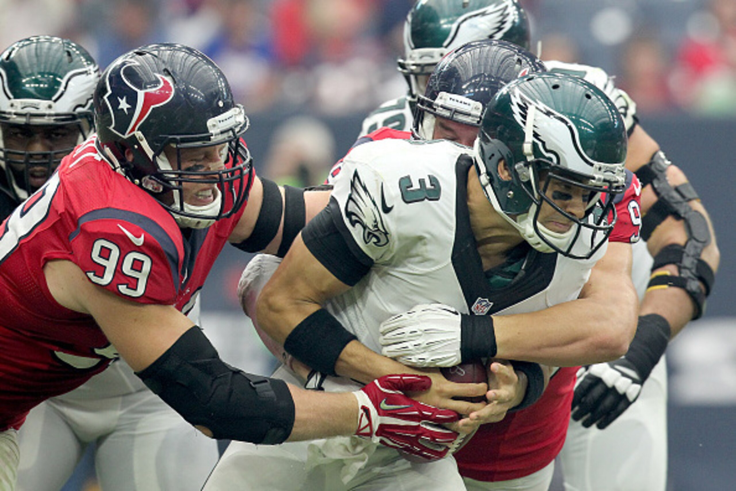 HOUSTON, TX- NOVEMBER 02: J.J. Watt #99 of the Houston Texans sacks Mark Sanchez #3 of the Philadelphia Eagles in the second half in a NFL game on November 2, 2014 at NRG Stadium in Houston, Texas. Eagles won 31 to 21. (Photo by Thomas B. Shea/Getty Image