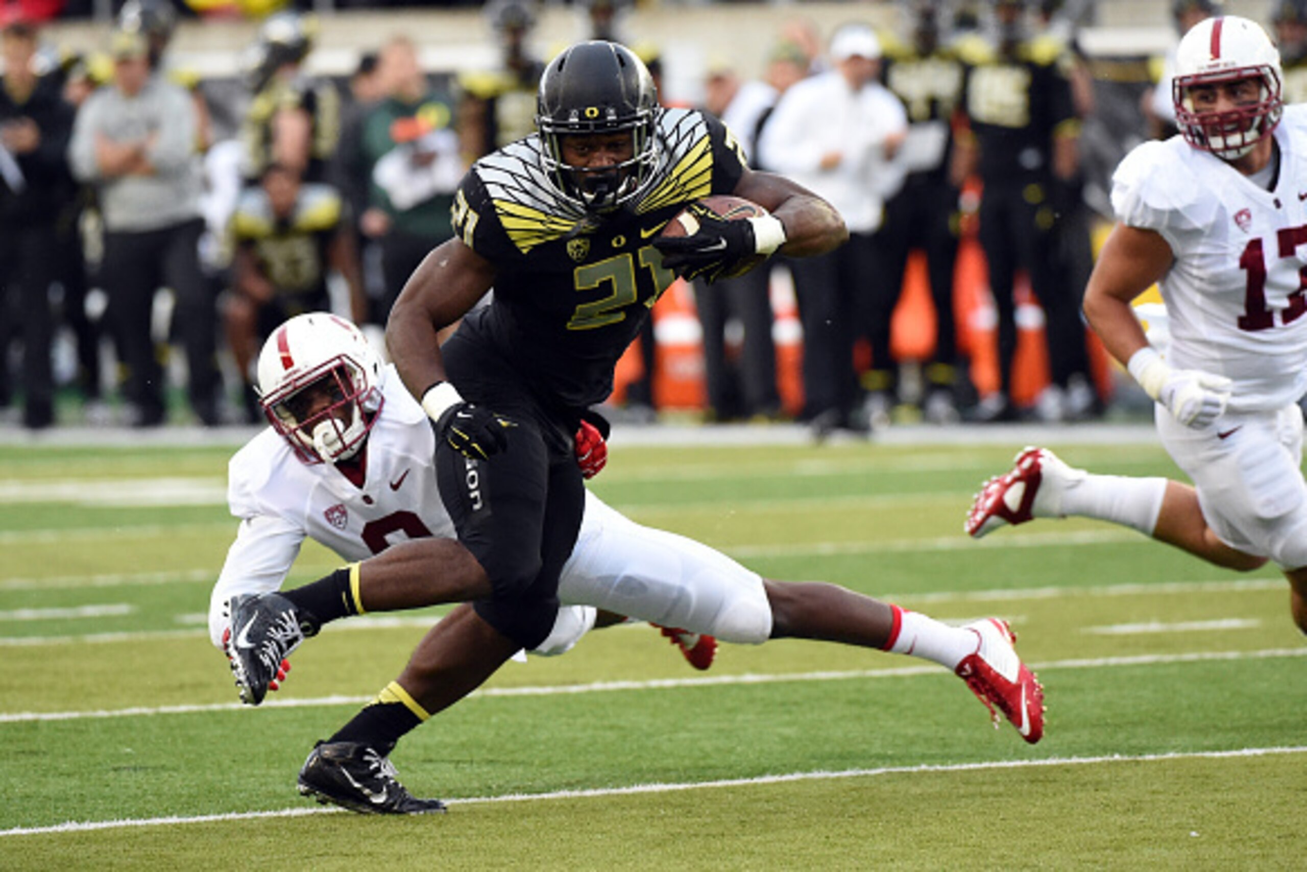 EUGENE, OR - NOVEMBER 1: Running back Royce Freeman #21 of the Oregon Ducks runs with the ball during the second quarter of the game against the Stanford Cardinal at Autzen Stadium on November 1, 2014 in Eugene, Oregon. (Photo by Steve Dykes/Getty Images)