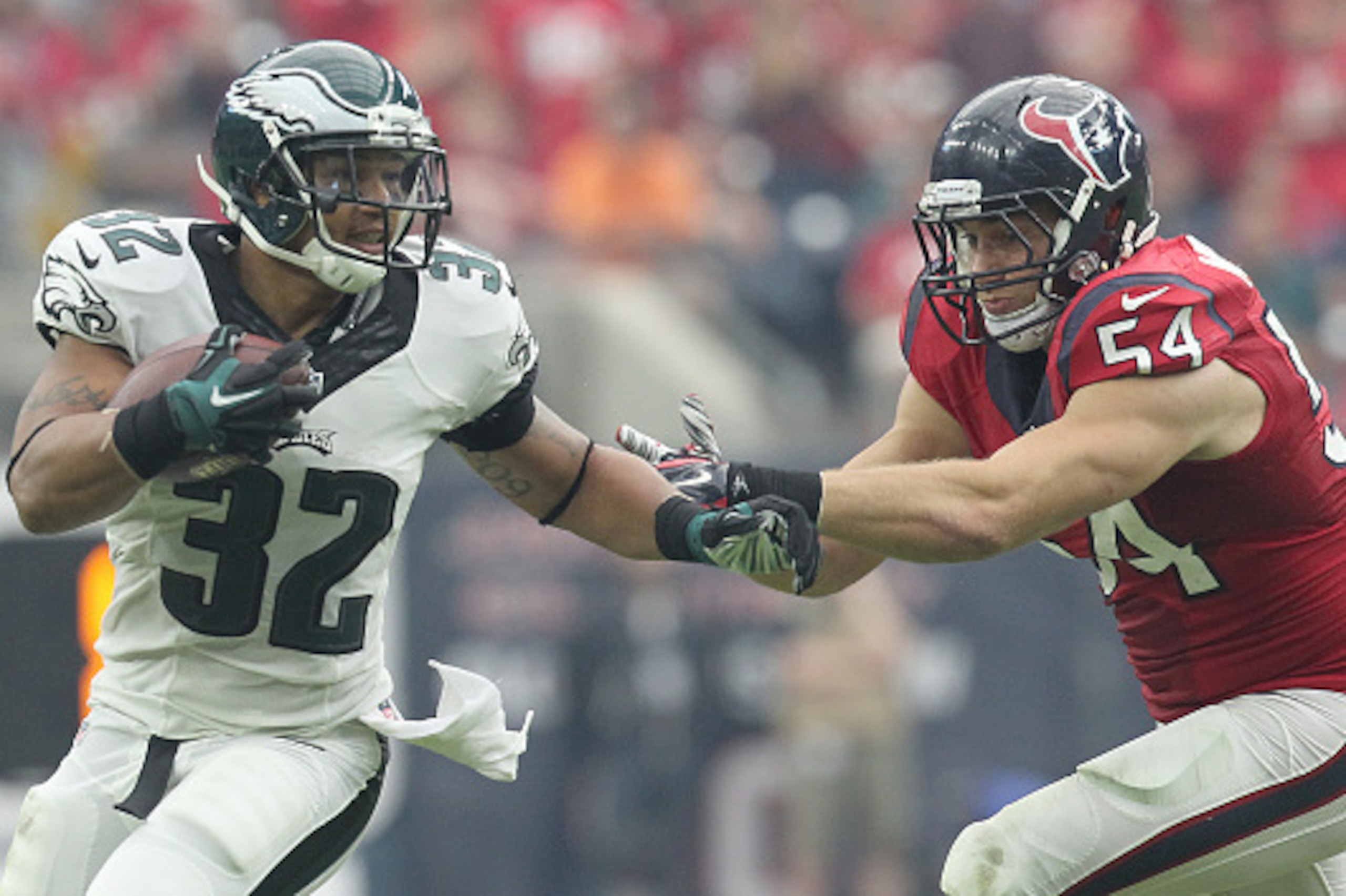 HOUSTON, TX- NOVEMBER 02: Chris Polk #32 of the Philadelphia Eagles is tackled by Mike Mohamed #54 of the Houston Texans in the second half in a NFL game on November 2, 2014 at NRG Stadium in Houston, Texas. Eagles won 31 to 21. (Photo by Thomas B. Shea/G