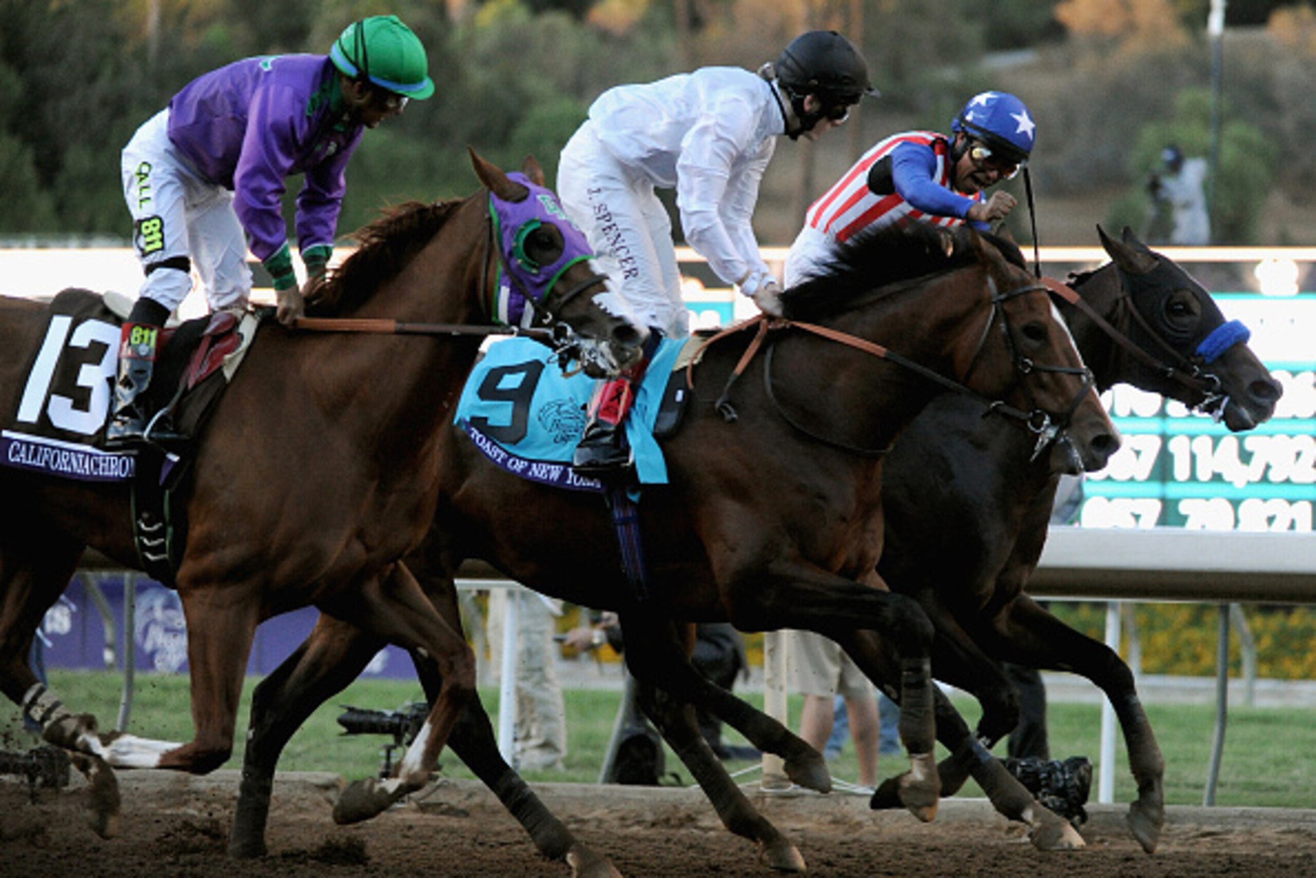 ARCADIA, CA - NOVEMBER 01:  Jockey Martin Garcia atop Bayern (R) celebrates ahead of jockey Victor Espinoza atop California Chrome, and jockey Jamie Spencer atop Toast of New York as he takes the 2014 Breeders' Cup Classic at Santa Anita Park on November 