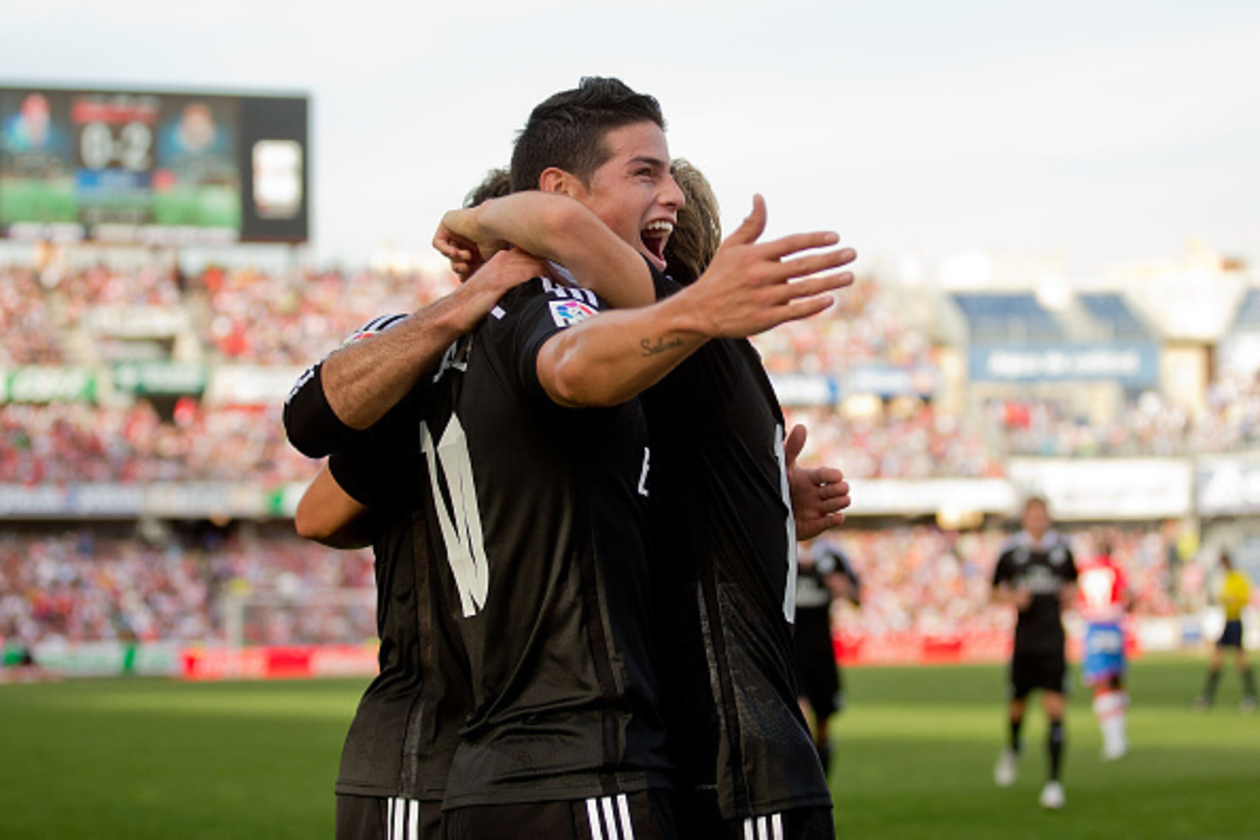 GRANADA, SPAIN - NOVEMBER 01:  James Rodriguez of Real Madrid CF celebrates with teammates scoring their second goal  during the La Liga match between Granada CF and Real Madrid CF at Nuevo Estadio de Los Carmenes on November 1, 2014 in Granada, Spain.  (