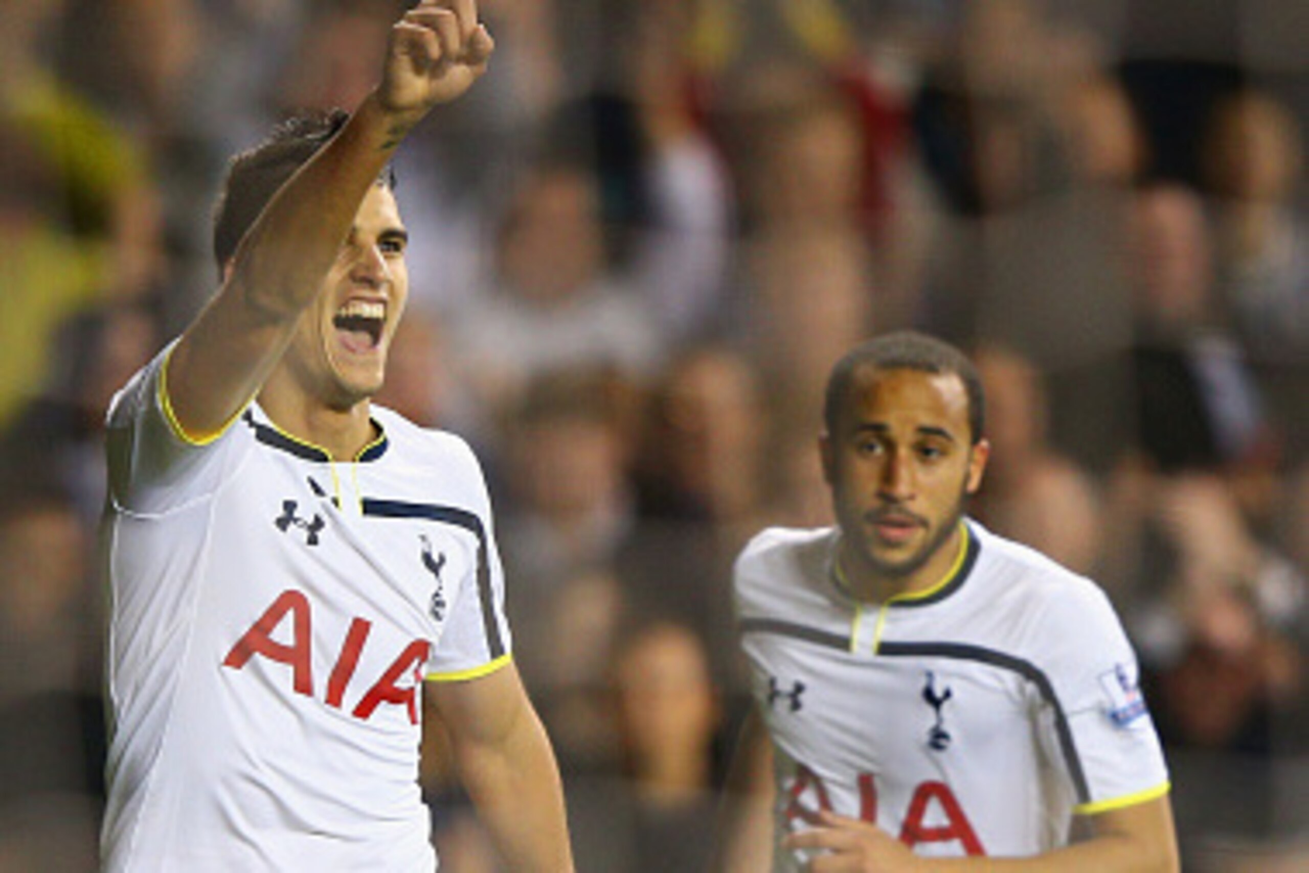LONDON, ENGLAND - OCTOBER 29:  Erik Lamela of Spurs celebrates scoring the opening goal with Andros Townsend of Spurs  during the Capital One Cup Fourth Round match Tottenham Hotspur and Brighton & Hove Albion at White Hart Lane on October 29, 2014 in Lon