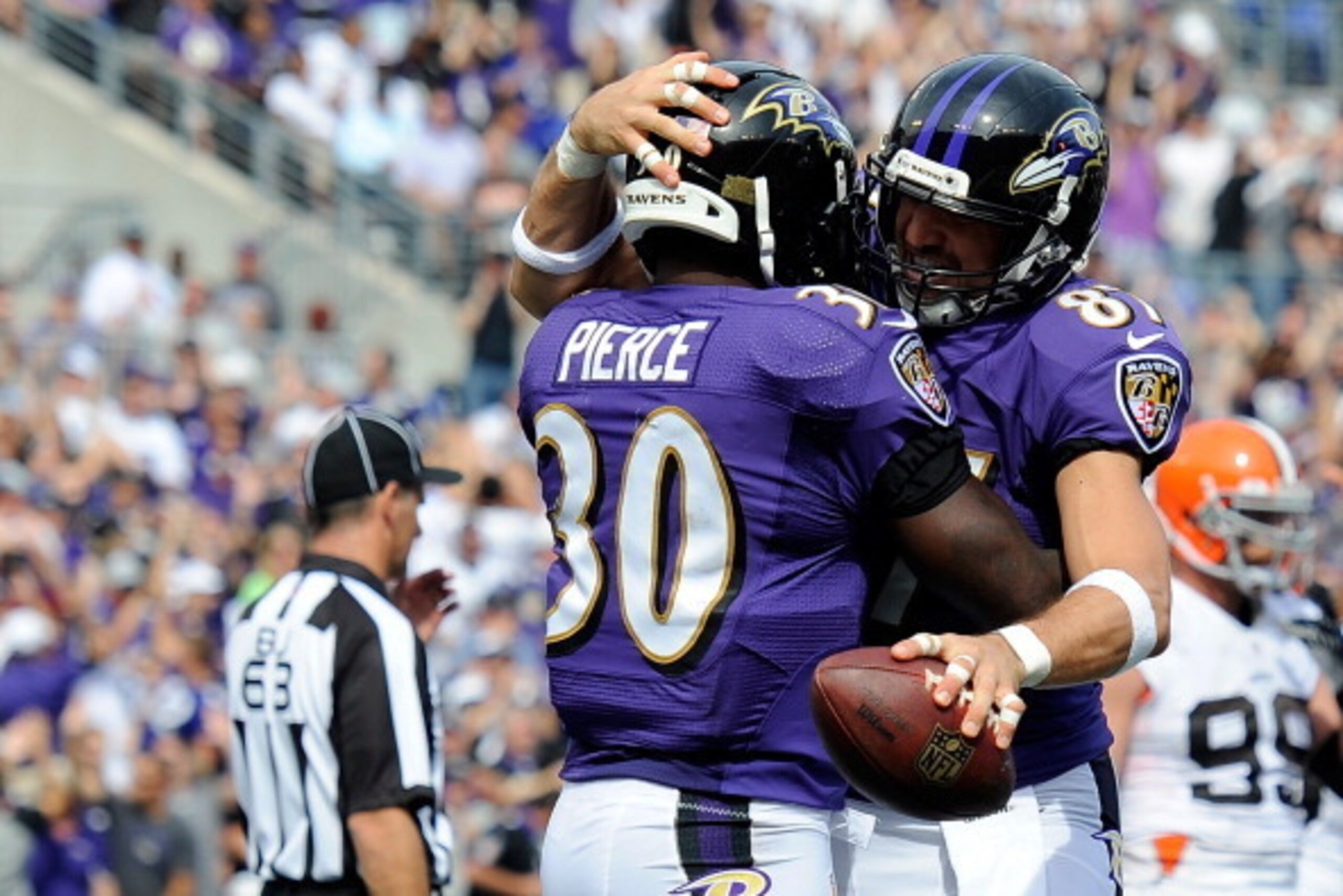 BALTIMORE, MD - SEPTEMBER 15:  Bernard Pierce #30 of the Baltimore Ravens celebrates with Dallas Clark #87 after scoring a 5-yard touchdown in the third quarter of a game against the Cleveland Browns at M&T Bank Stadium on September 15, 2013 in Baltimore,