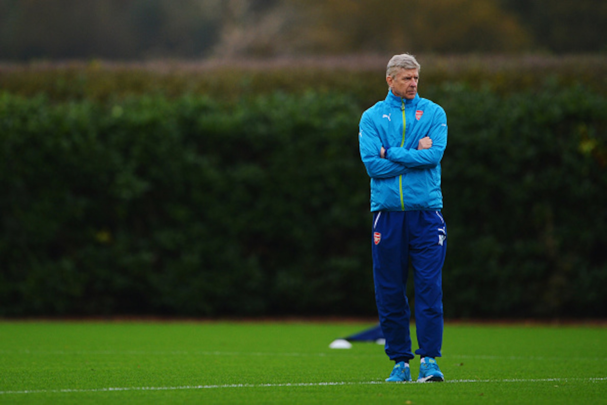 ST ALBANS, ENGLAND - NOVEMBER 03:  Arsene Wenger manager of Arsenal looks on during an Arsenal training session ahead of the UEFA Champions League match against RSC Anderlecht at London Colney on November 3, 2014 in St Albans, England.  (Photo by Michael 