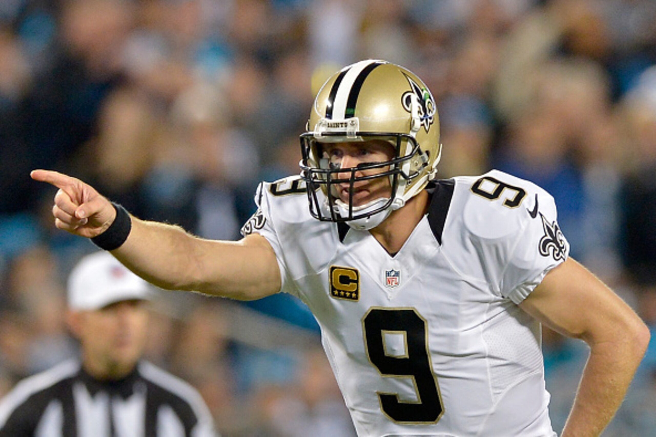CHARLOTTE, NC - OCTOBER 30:  Drew Brees #9 of the New Orleans Saints calls a play against the Carolina Panthers in the 1st quarter during their game at Bank of America Stadium on October 30, 2014 in Charlotte, North Carolina.  (Photo by Grant Halverson/Ge