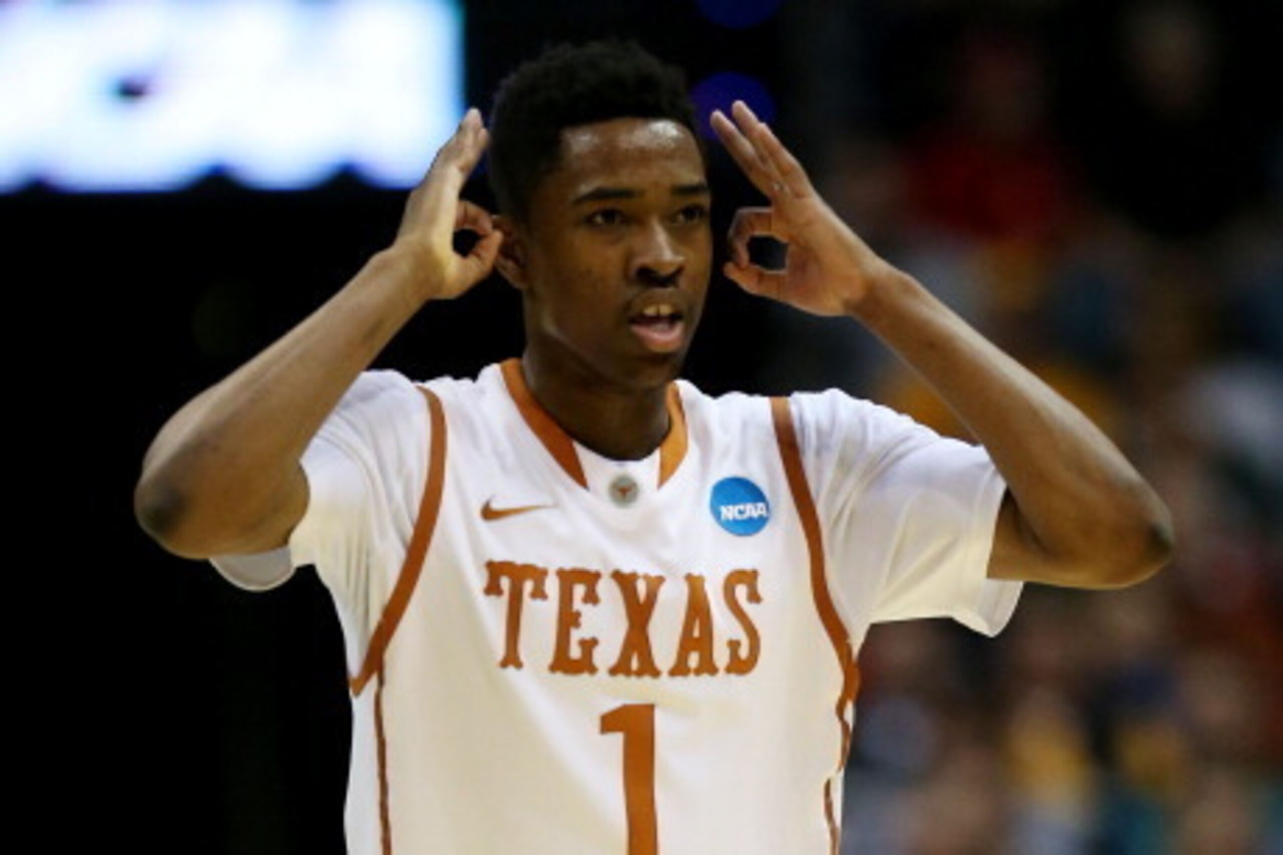 MILWAUKEE, WI - MARCH 20:  Isaiah Taylor #1 of the Texas Longhorns celebrates a three point basket in the first half against the Arizona State Sun Devils during the second round of the 2014 NCAA Men's Basketball Tournament at BMO Harris Bradley Center on 