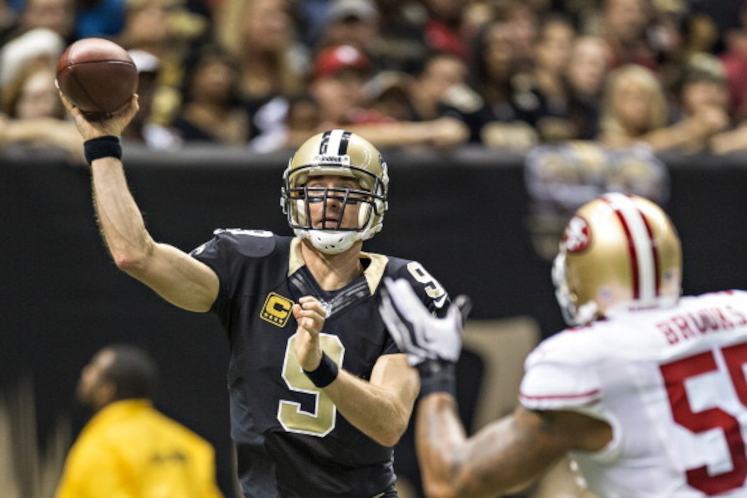 NEW ORLEANS, LA - NOVEMBER 17:  Drew Brees #9 of the New Orleans Saints throws a pass the San Francisco 49ers at  Mercedes-Benz Superdome on November 17, 2013 in New Orleans, Louisiana.  The Saints defeated the 49ers 23-20.  (Photo by Wesley Hitt/Getty Im