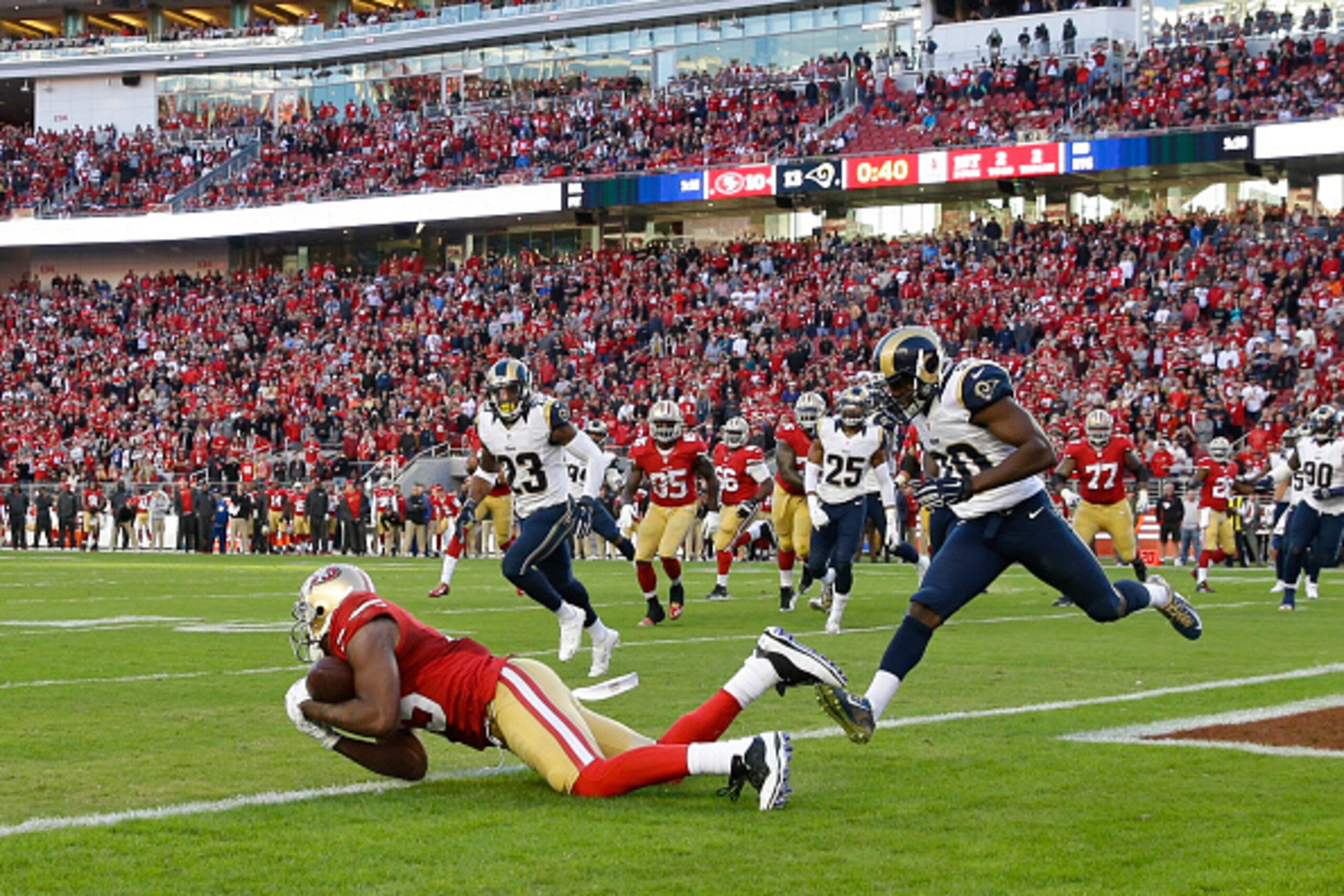 SANTA CLARA, CA - NOVEMBER 02: Michael Crabtree #15 of the San Francisco 49ers catches a pass short of the goal line against the St. Louis Rams during the fourth quarter at Levi's Stadium on November 2, 2014 in Santa Clara, California.  The St. Louis Rams