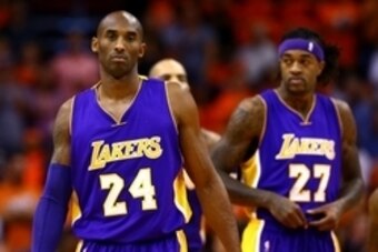 Oct 29, 2014; Phoenix, AZ, USA; Los Angeles Lakers guard Kobe Bryant (24) and forward Jordan Hill (27) against the Phoenix Suns during the home opener at US Airways Center. The Suns defeated the Lakers 119-99. Mandatory Credit: Mark J. Rebilas-USA TODAY S