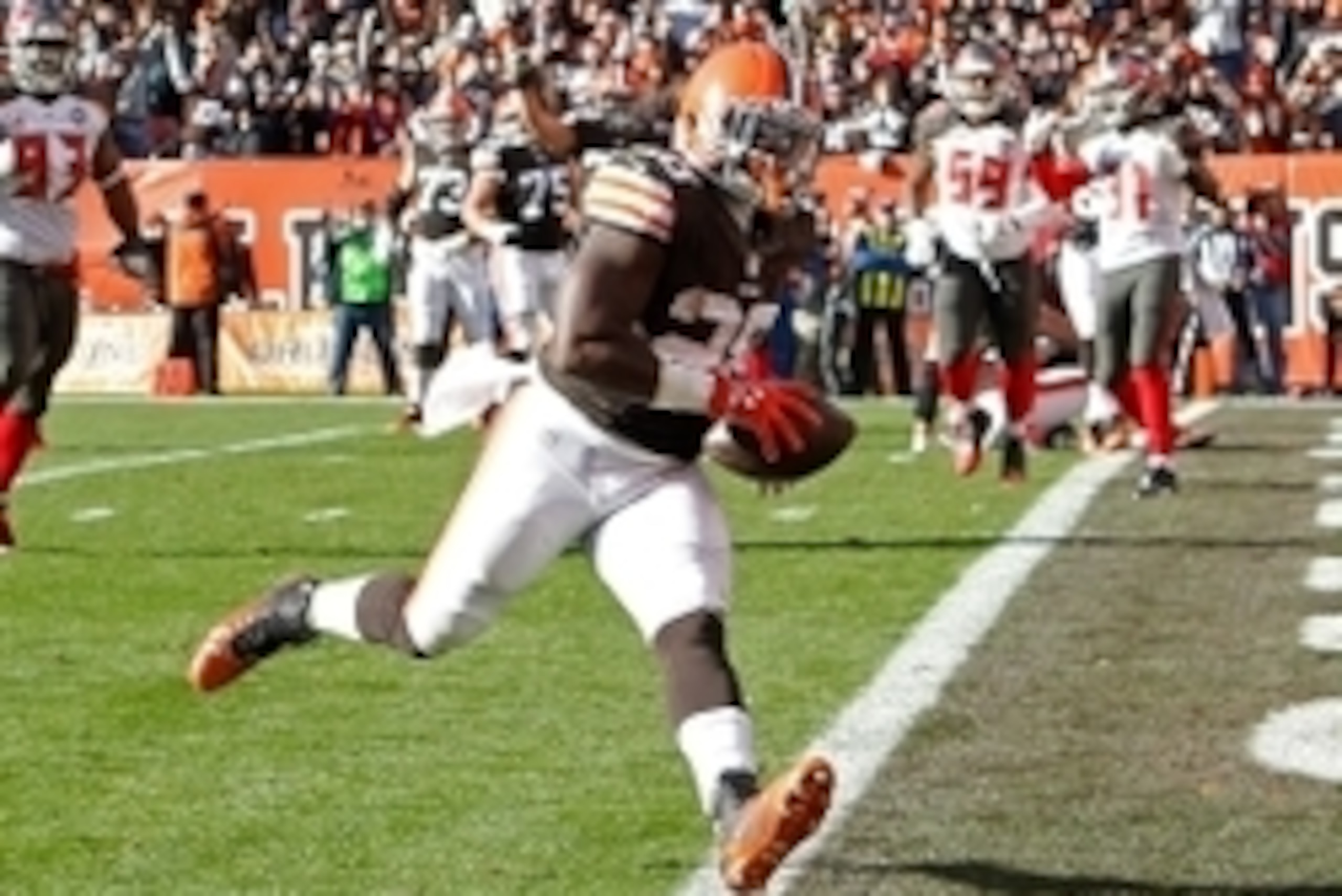 Nov 2, 2014; Cleveland, OH, USA; Cleveland Browns running back Terrance West (28) scores a touchdown against the Tampa Bay Buccaneers during the third quarter at FirstEnergy Stadium. The Browns won 22-17. Mandatory Credit: Ron Schwane-USA TODAY Sports
