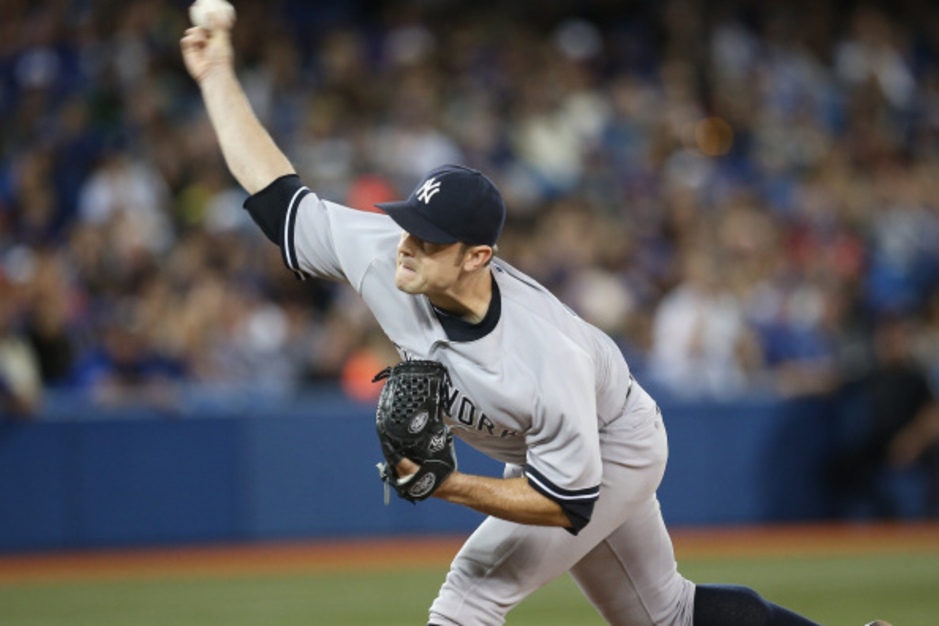 TORONTO, CANADA - AUGUST 29: David Robertson #30 of the New York Yankees delivers a pitch in the ninth inning during MLB game action against the Toronto Blue Jays on August 29, 2014 at Rogers Centre in Toronto, Ontario, Canada. (Photo by Tom Szczerbowski/ TORONTO, CANADA - AUGUST 29: David Robertson #30 of the New York Yankees delivers a pitch in the ninth inning during MLB game action against the Toronto Blue Jays on August 29, 2014 at Rogers Centre in Toronto, Ontario, Canada. (Photo by Tom Szczerbowski/