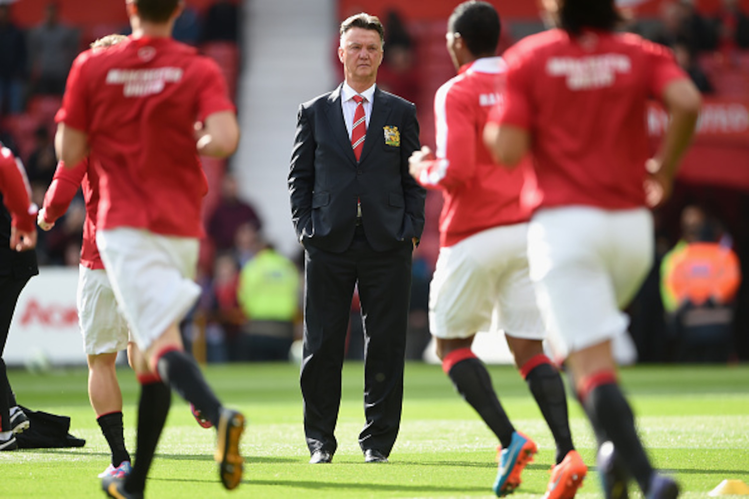 MANCHESTER, ENGLAND - OCTOBER 05:  Manchester United Manager Louis van Gaal watches his players prior to the Barclays Premier League match between Manchester United and Everton at Old Trafford on October 5, 2014 in Manchester, England.  (Photo by Michael 