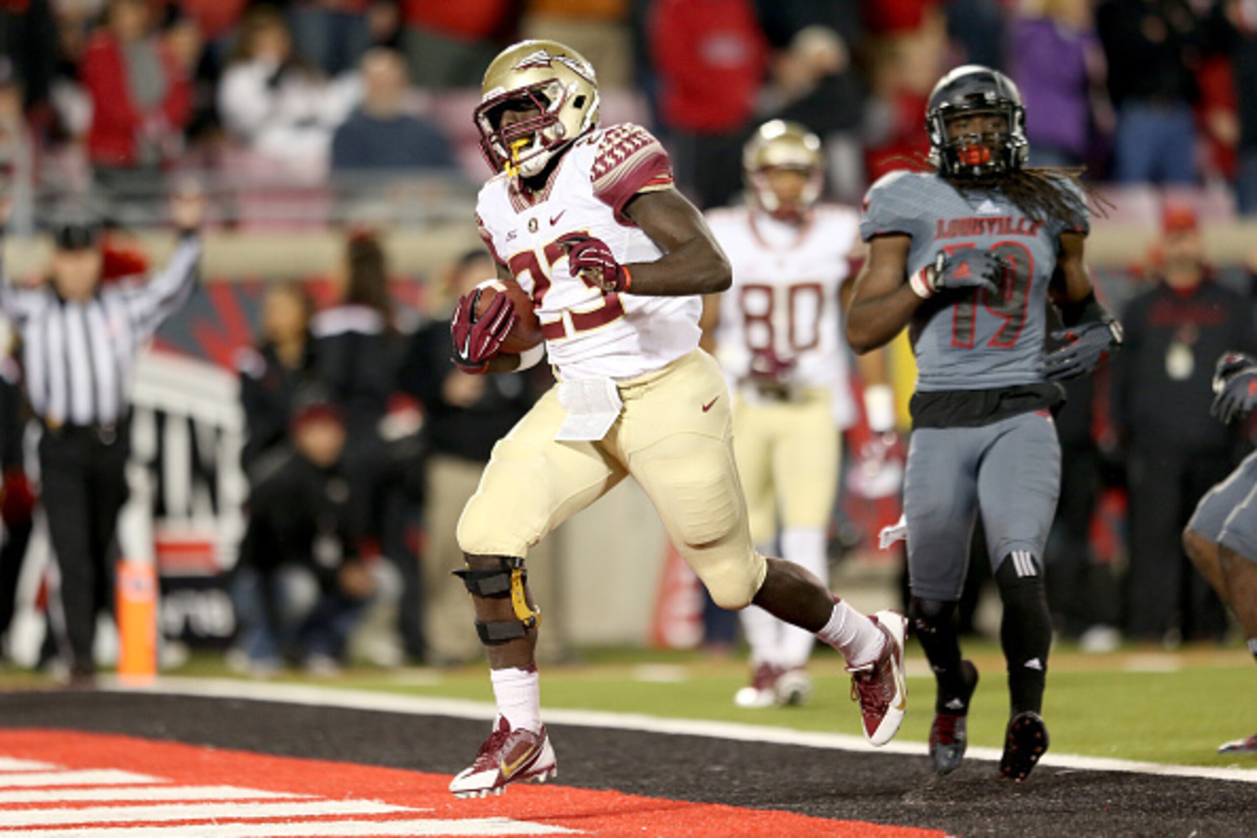 LOUISVILLE, KY - OCTOBER 30:  Freddie Stevenson #23 of the Florida State Seminoles scores a touchdown during the game against the Louisville Cardinals at Papa John's Cardinal Stadium on October 30, 2014 in Louisville, Kentucky.  (Photo by Andy Lyons/Getty