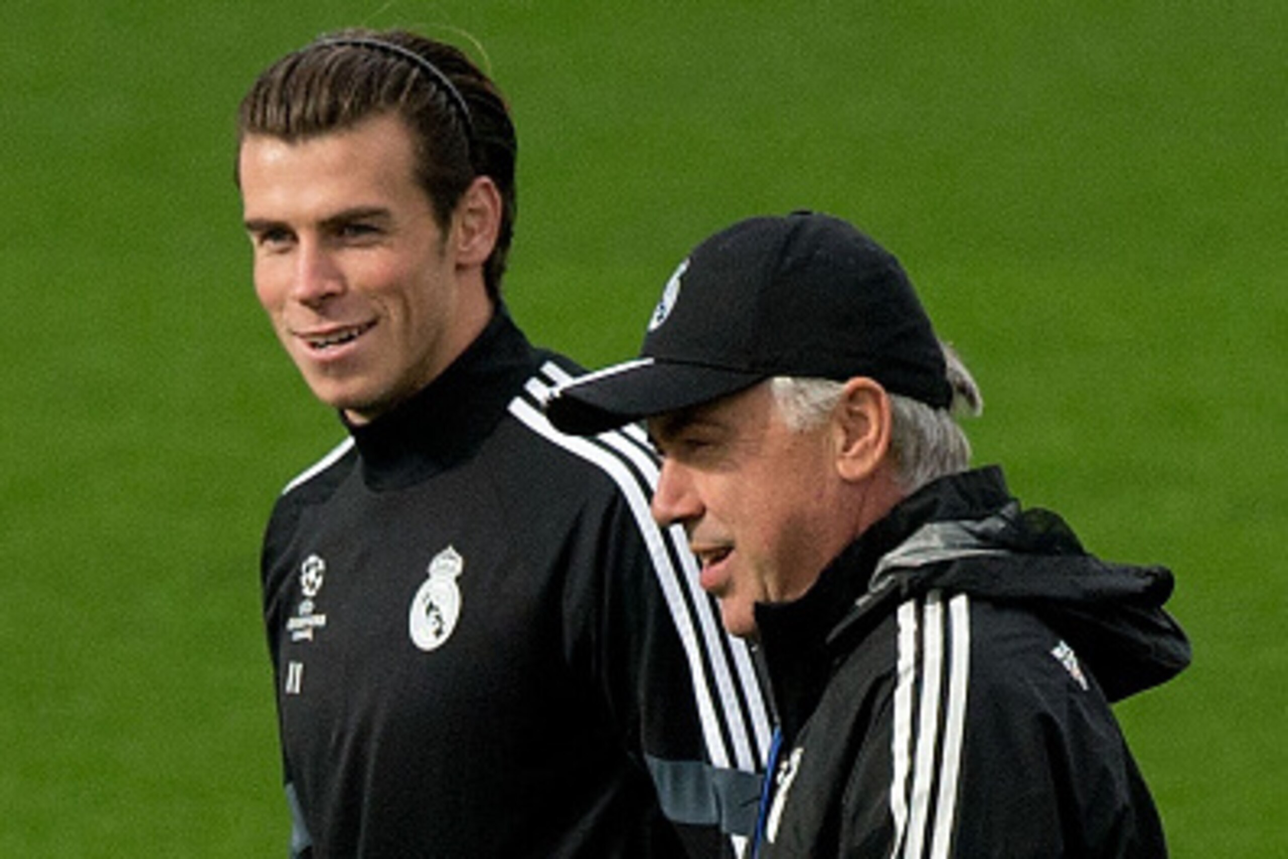 MADRID, SPAIN - NOVEMBER 03: Gareth Bale (L) of Real Madrid CF walks on with his head coach Carlo Ancelotti (R) during the training session ahead of the UEFA Champions League Group B match between Real Madrid CF and Liverpool FC at Valdebebas training gro