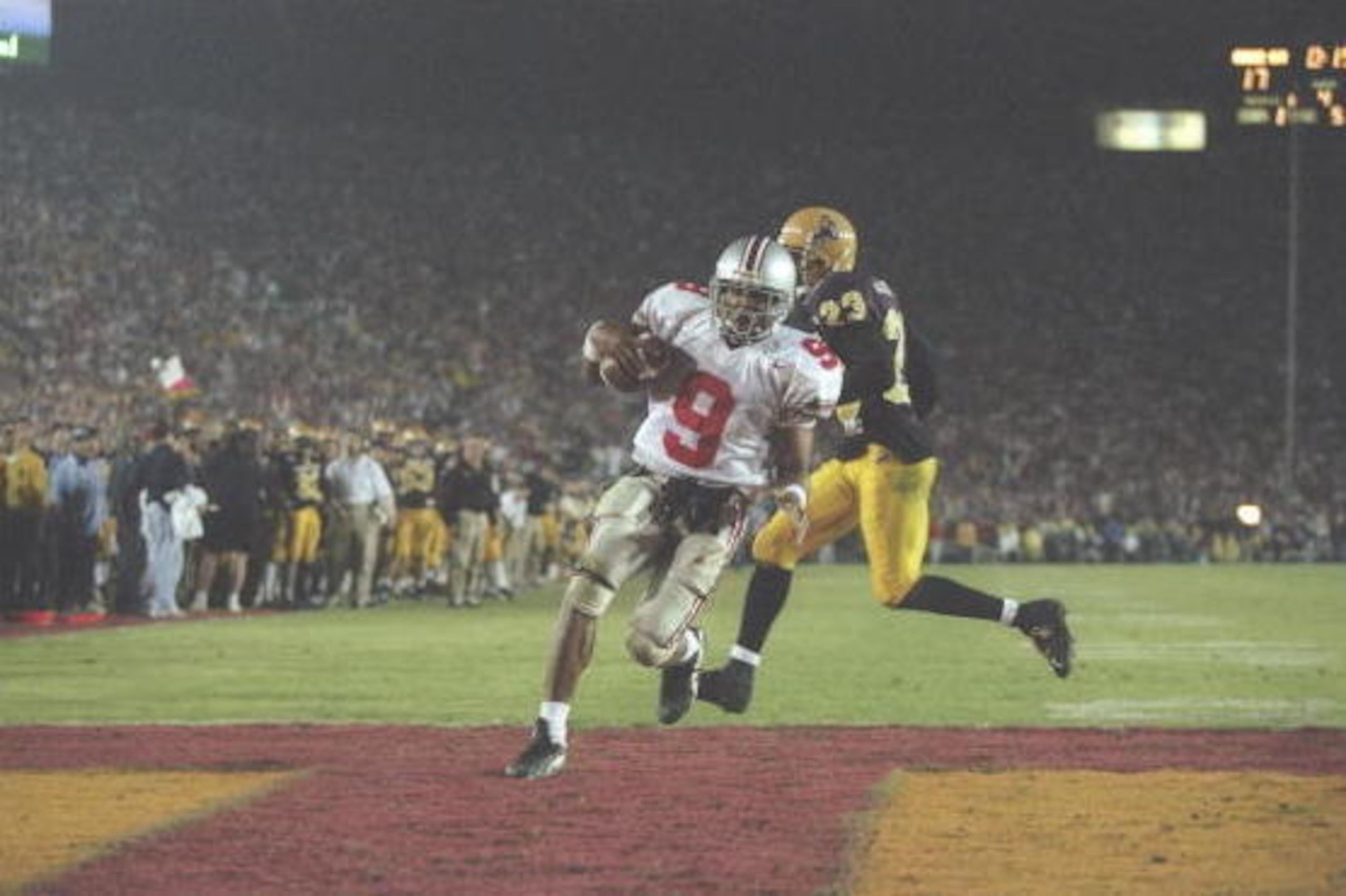 1 Jan 1997:  David Boston of the Ohio State Buckeyes moves the ball as Arizona State Sun Devils defensive back Courtney Jackson chases him during the Rose Bowl at the Rose Bowl in Pasadena, California.  Ohio State won the game, 20-17. Mandatory Credit: Je