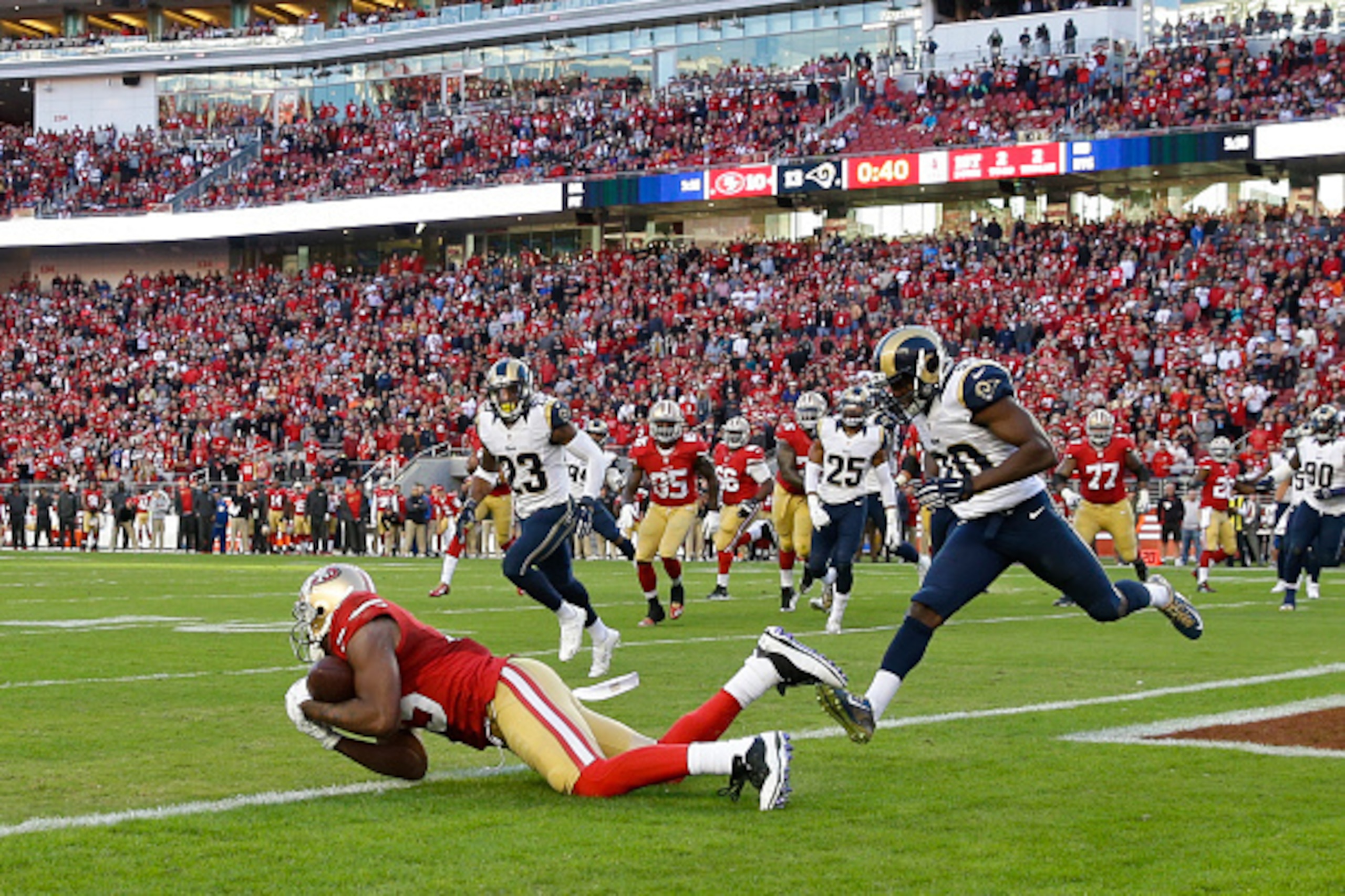 SANTA CLARA, CA - NOVEMBER 02: Michael Crabtree #15 of the San Francisco 49ers catches a pass short of the goal line against the St. Louis Rams during the fourth quarter at Levi's Stadium on November 2, 2014 in Santa Clara, California.  The St. Louis Rams