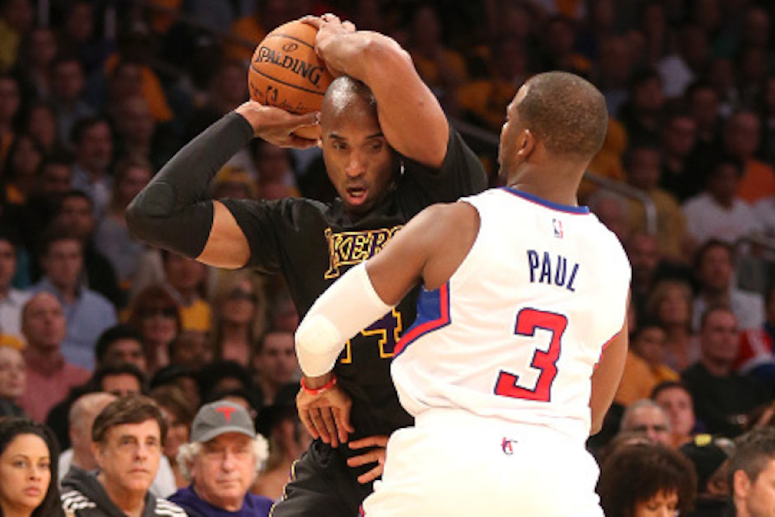 LOS ANGELES, CA - OCTOBER 31:  Kobe Bryant #24 of the Los Angeles Lakers controls the ball against Chris Paul #3 of the Los Angeles Clippers at Staples Center on October 31, 2014 in Los Angeles, California. The Clippers won 118-111.  NOTE TO USER: User ex
