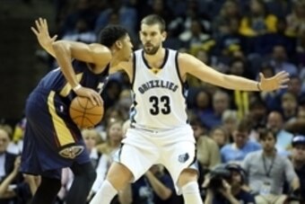 Nov 3, 2014; Memphis, TN, USA; Memphis Grizzlies center Marc Gasol (33) defends against New Orleans Pelicans forward Anthony Davis (23) during the second half at FedExForum. Memphis defeated New Orleans 93-81. Mandatory Credit: Nelson Chenault-USA TODAY S