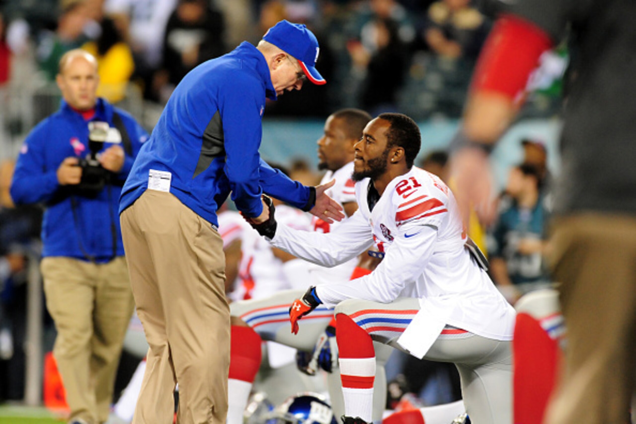 PHILADELPHIA, PA - OCTOBER 12: Head Coach Tom Coughlin of the New York Giants high fives cornerback Dominique Rodgers-Cromartie #21 prior to a football game against the Philadelphia Eagles at Lincoln Financial Field on October 12, 2014 in Philadelphia, Pe