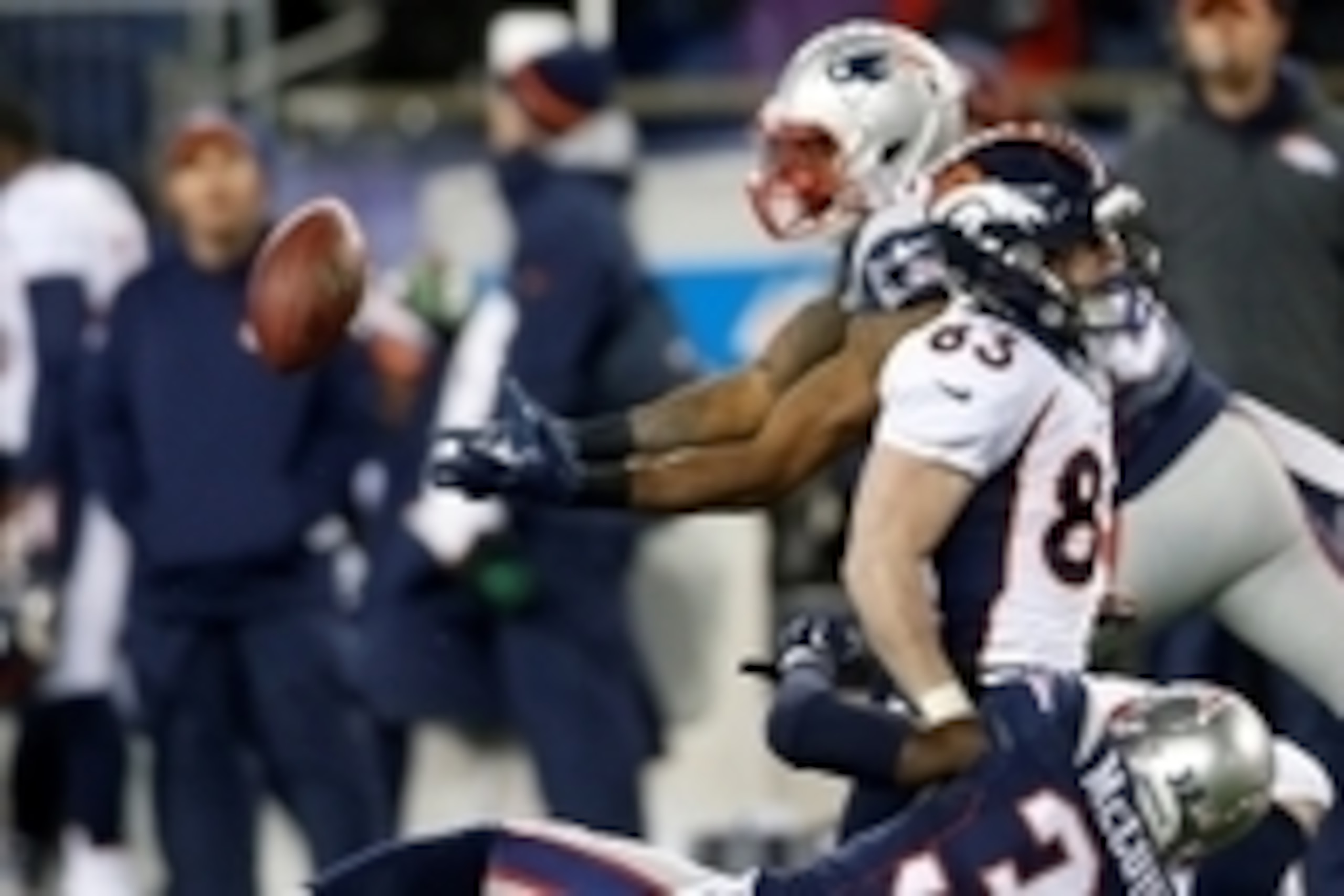 Nov 2, 2014; Foxborough, MA, USA; New England Patriots free safety Devin McCourty (32) breaks up a pass intended for Denver Broncos wide receiver Wes Welker (83) and intercepted by cornerback Brandon Browner (39) during the third quarter at Gillette Stadi
