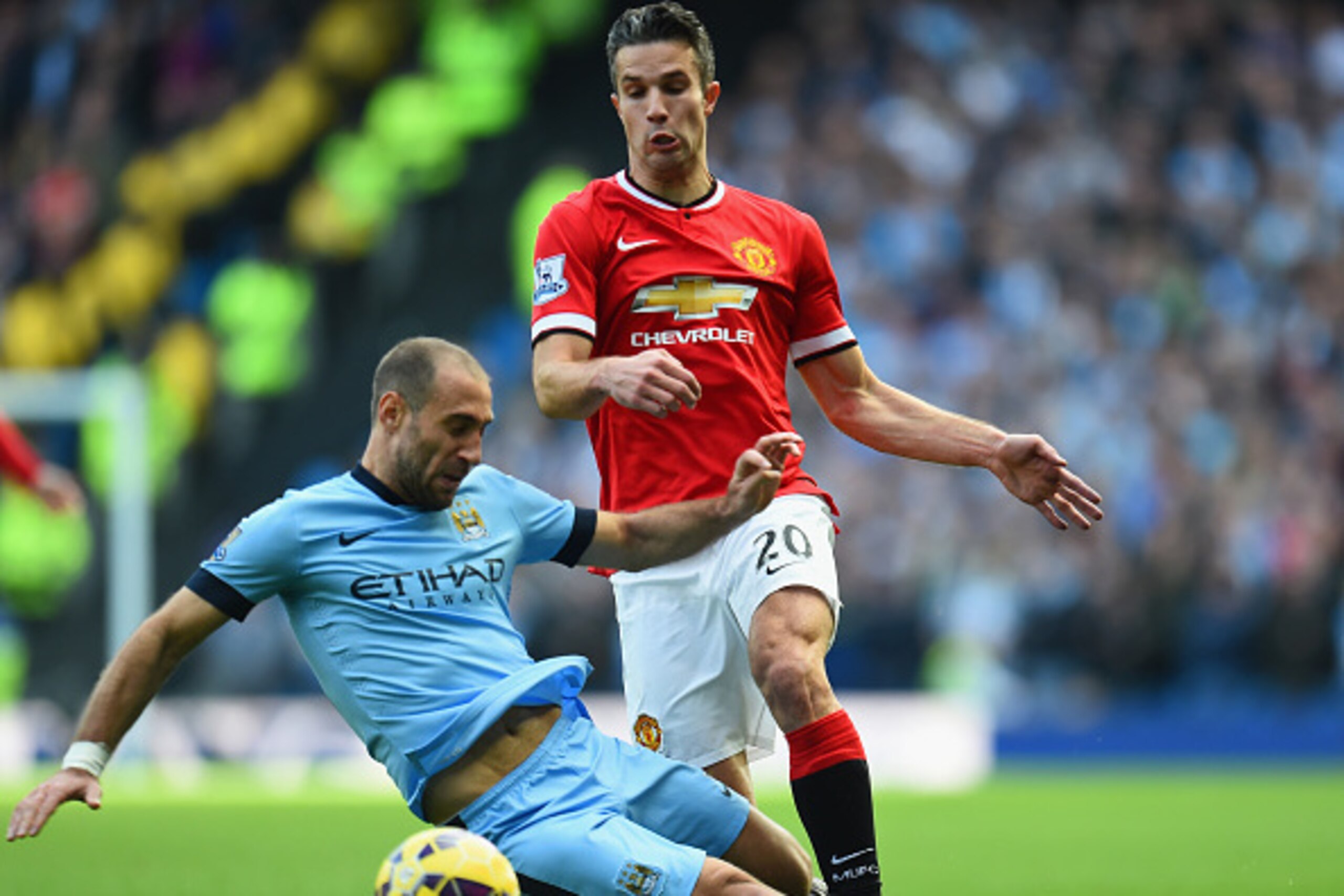 MANCHESTER, ENGLAND - NOVEMBER 02: Pablo Zabaleta of Manchester City tackles Robin van Persie of Manchester United during the Barclays Premier League match between Manchester City and Manchester United at Etihad Stadium on November 2, 2014 in Manchester, 