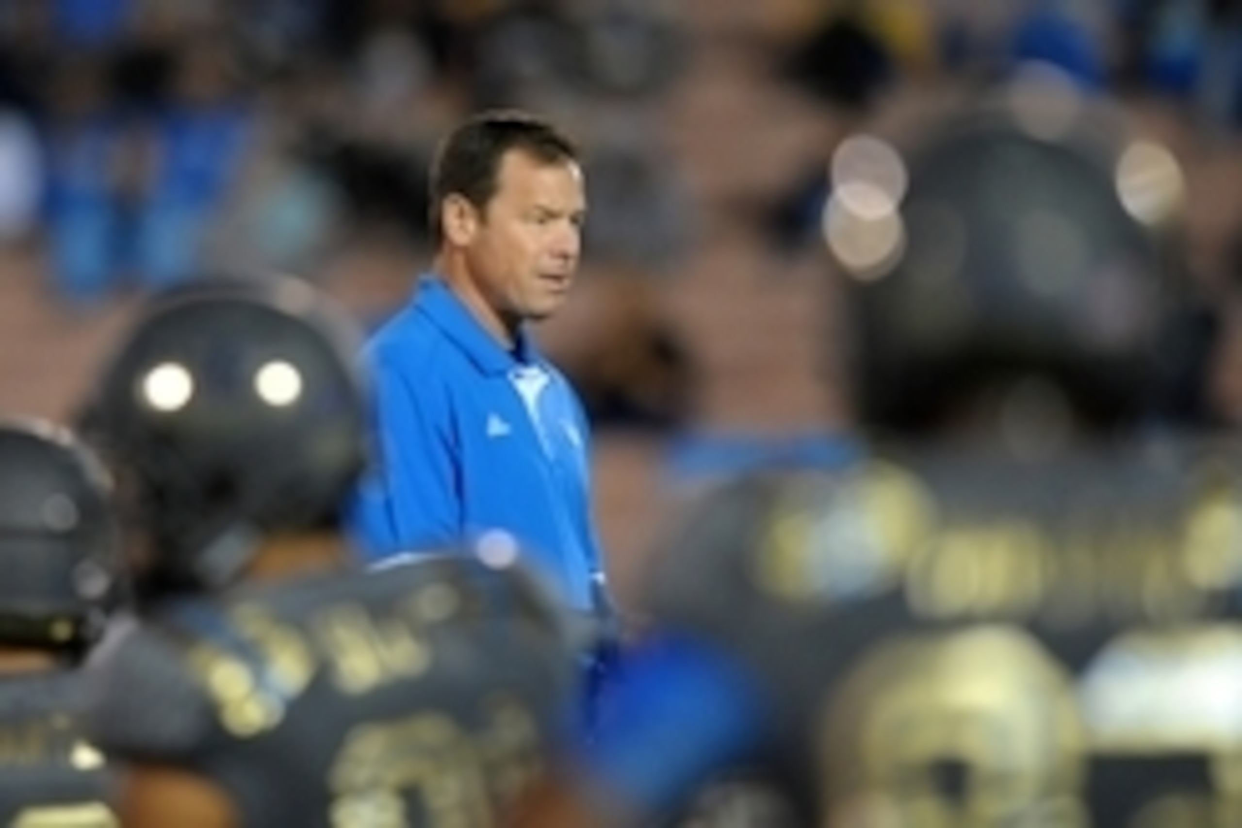 Nov 1, 2014; Pasadena, CA, USA; UCLA Bruins head coach Jim Mora walks through his players as they stretch before the game against the Arizona Wildcats at Rose Bowl. Mandatory Credit: Jake Roth-USA TODAY Sports Nov 1, 2014; Pasadena, CA, USA; UCLA Bruins head coach Jim Mora walks through his players as they stretch before the game against the Arizona Wildcats at Rose Bowl. Mandatory Credit: Jake Roth-USA TODAY Sports