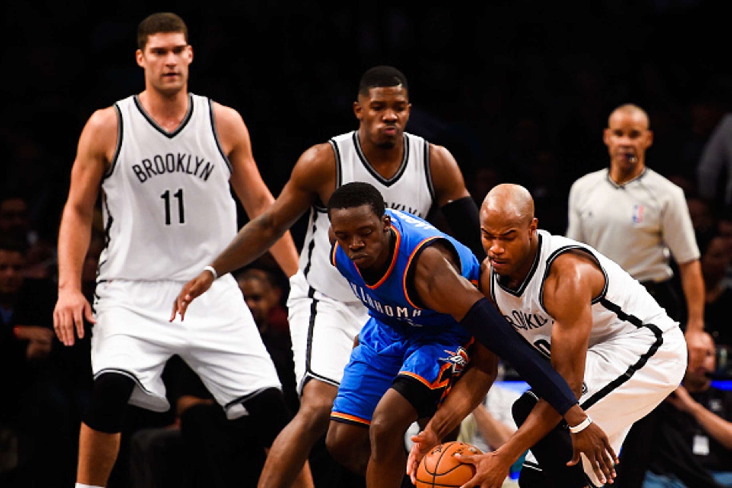 NEW YORK, NY - NOVEMBER 03: Jarrett Jack #0 of the Brooklyn Nets fights for the ball with Reggie Jackson #15 of the Oklahoma City Thunder in the third quarter at the Barclays Center on November 3, 2014 in the Brooklyn borough of New York City. NOTE TO USE