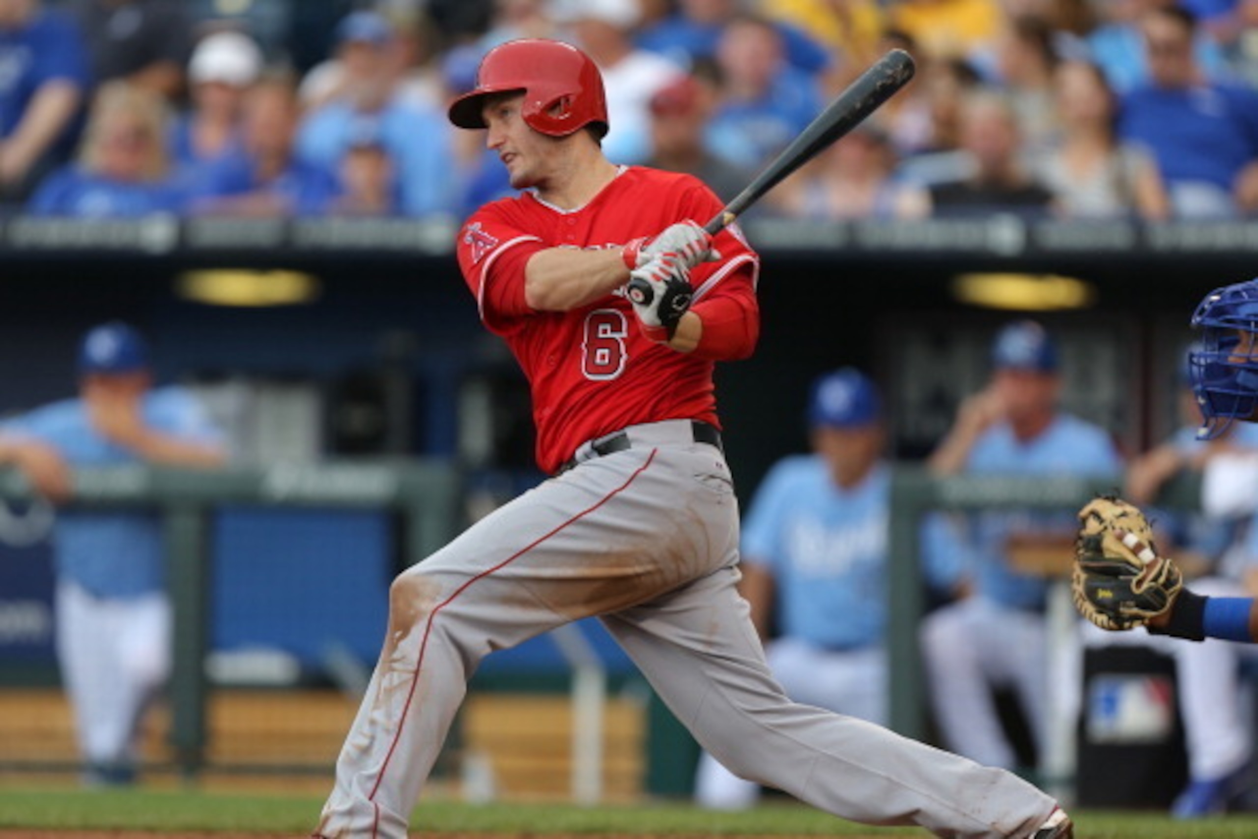 KANSAS CITY, MO - JUNE 28:  David Freese #6 of the Los Angeles Angels of Anaheim hits an RBI single in the fourth inning during a game against the Kansas City Royals at Kauffman Stadium on June 28, 2014 in Kansas City, Missouri. (Photo by Ed Zurga/Getty I
