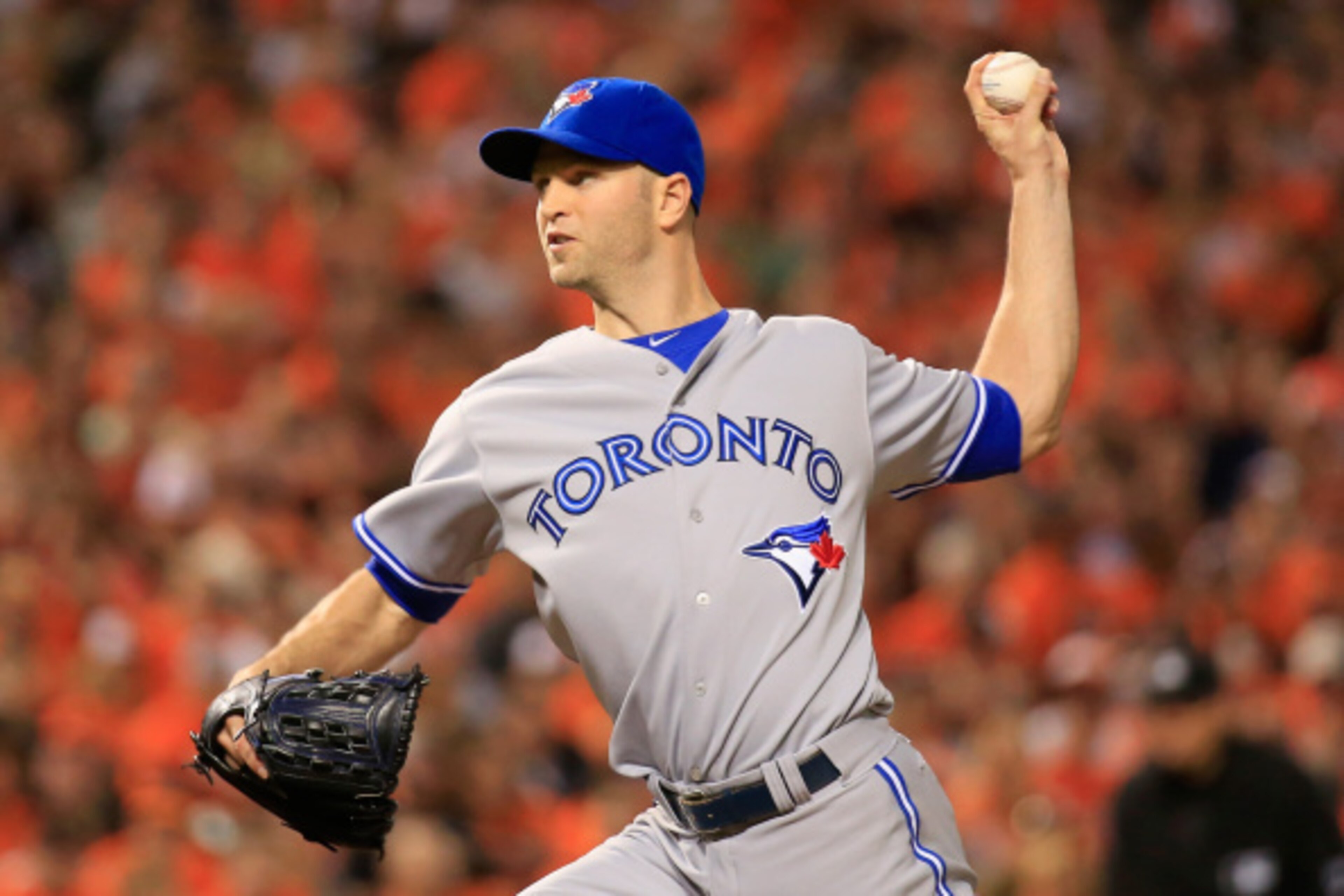 BALTIMORE, MD - SEPTEMBER 17:  Starting pitcher J.A. Happ #48 of the Toronto Blue Jays throws to a Baltimore Orioles batter during the second inning at Oriole Park at Camden Yards on September 17, 2014 in Baltimore, Maryland.  (Photo by Rob Carr/Getty Ima
