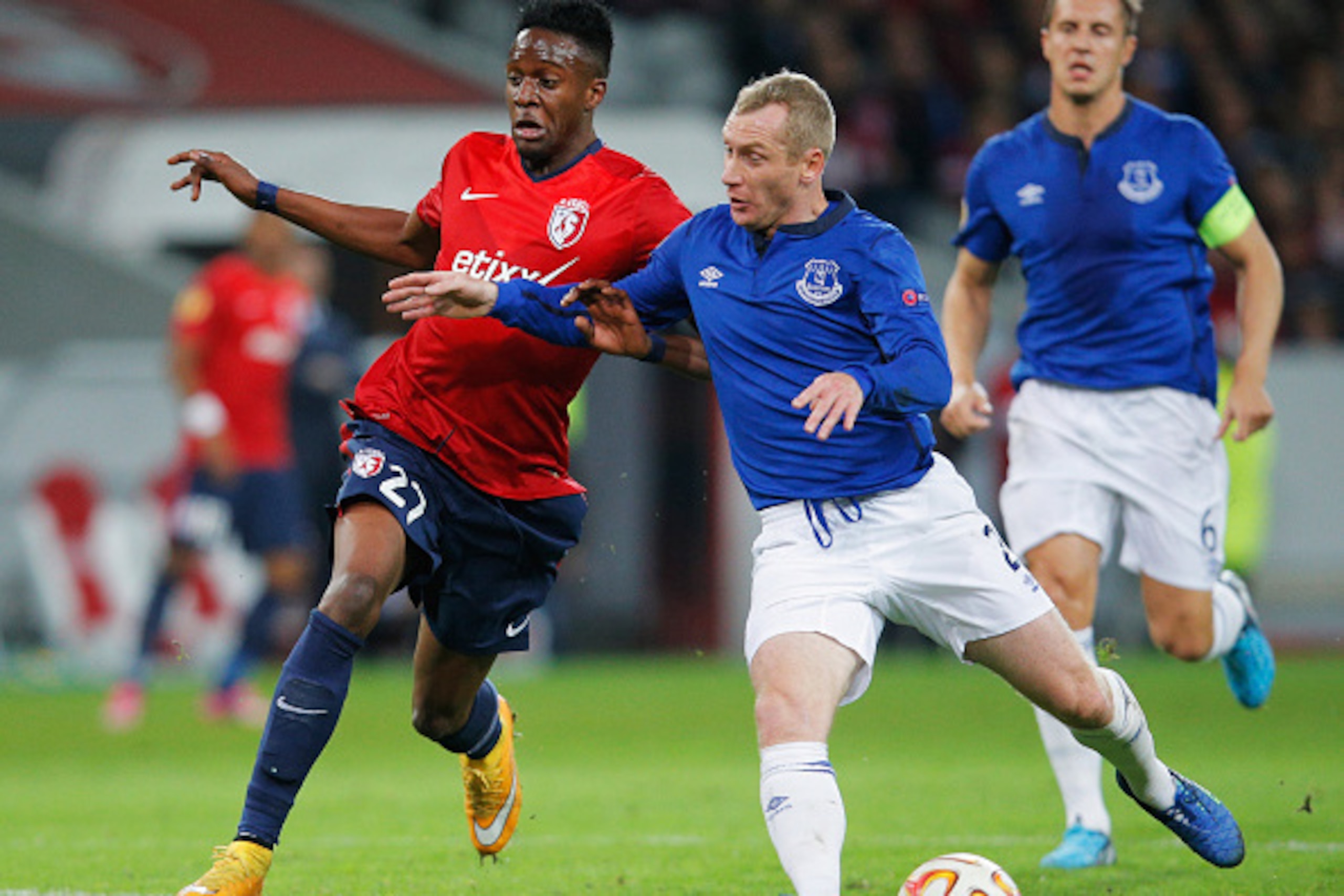 LILLE, FRANCE - OCTOBER 23:  Tony Hibbert of Everton (2) and Divock Origi of Lille battle for the ball during the UEFA Europa League Group H match between LOSC Lille and Everton at Grand Stade Lille Metropole on October 23, 2014 in Lille, France.  (Photo 