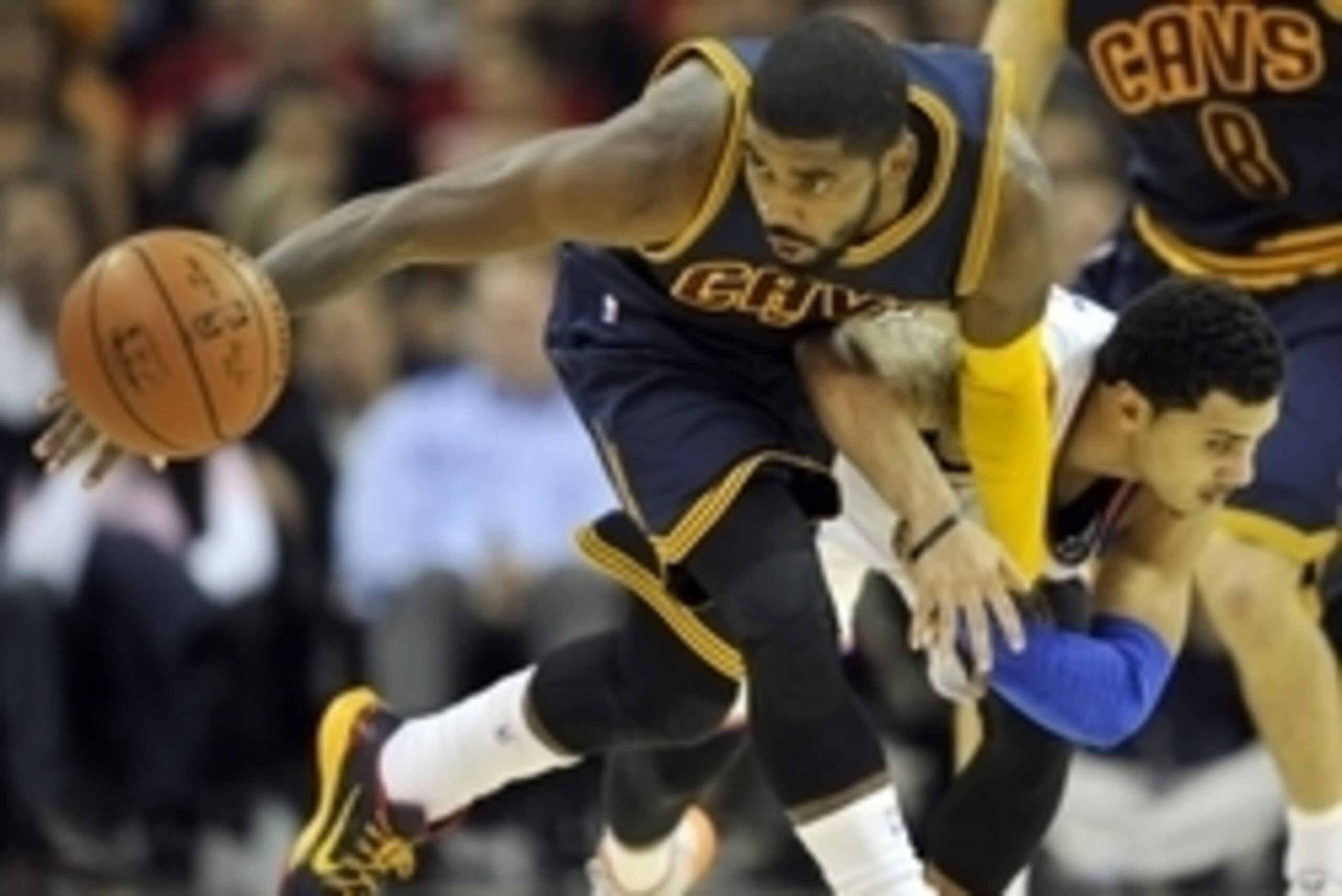 Oct 30, 2014; Cleveland, OH, USA; Cleveland Cavaliers guard Kyrie Irving (left) steals the ball from New York Knicks guard Shane Larkin (0) in the fourth quarter at Quicken Loans Arena. Mandatory Credit: David Richard-USA TODAY Sports