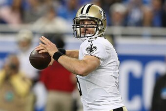 DETROIT, MI - OCTOBER 19: Drew Brees #9 of the New Orleans Saints looks to throw a first quarter pass against the Detroit Lions at Ford Field on October 19, 2014 in Detroit, Michigan. (Photo by Leon Halip/Getty Images)