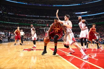 CHICAGO, IL - OCTOBER 31:  Tristan Thompson #13 of the Cleveland Cavaliers handles the ball against the Chicago Bulls during a game at the United Center  on October 31, 2014 in Chicago, Illinois. NOTE TO USER: User expressly acknowledges and agrees that, 