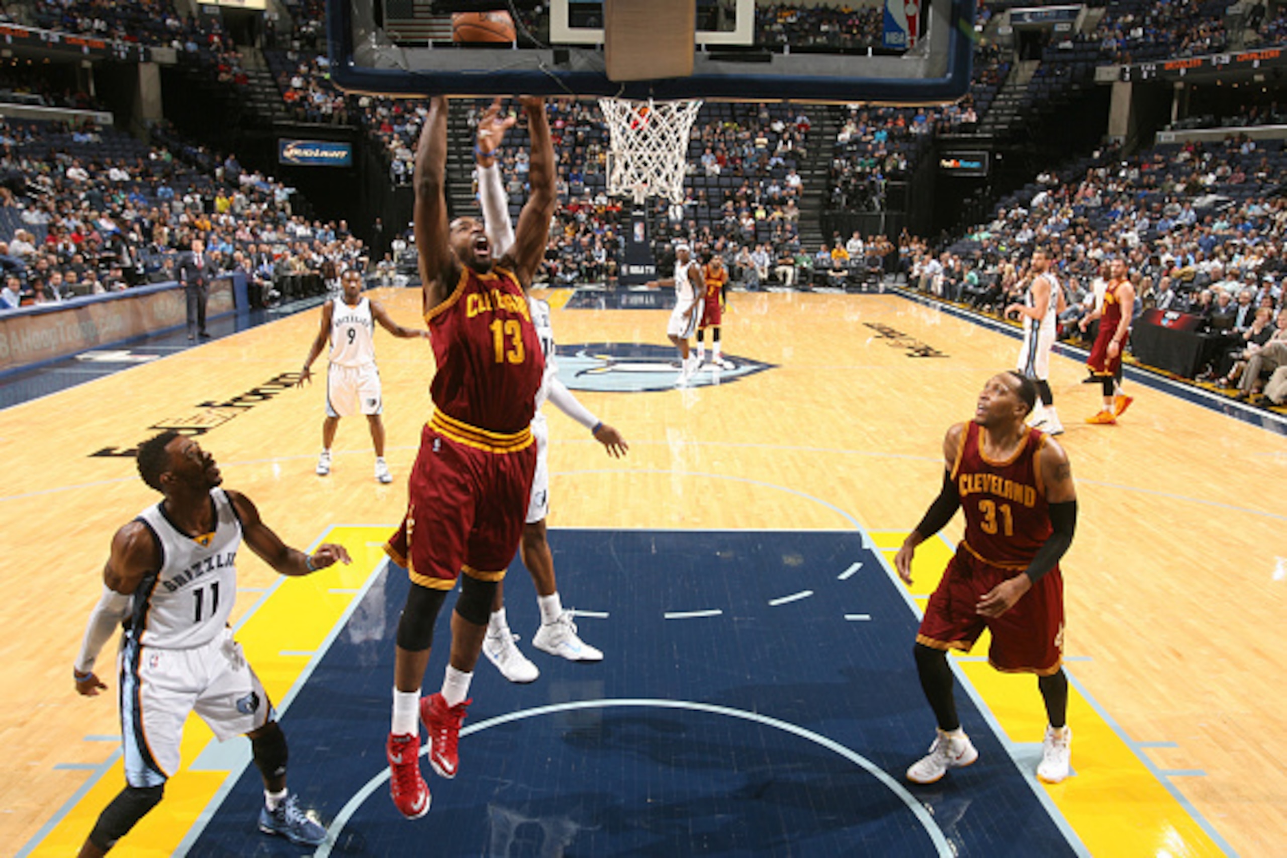 MEMPHIS, TN - OCTOBER 22: Tristan Thompson #13 of the Cleveland Cavaliers dunks against the Memphis Grizzlies on October 22, 2014 at FedExForum in Memphis, Tennessee. NOTE TO USER: User expressly acknowledges and agrees that, by downloading and or using t
