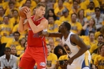 May 1, 2014; Oakland, CA, USA; Los Angeles Clippers forward Blake Griffin (32) controls the basketball against Golden State Warriors forward Draymond Green (23) during the second quarter in game six of the first round of the 2014 NBA Playoffs at Oracle Ar