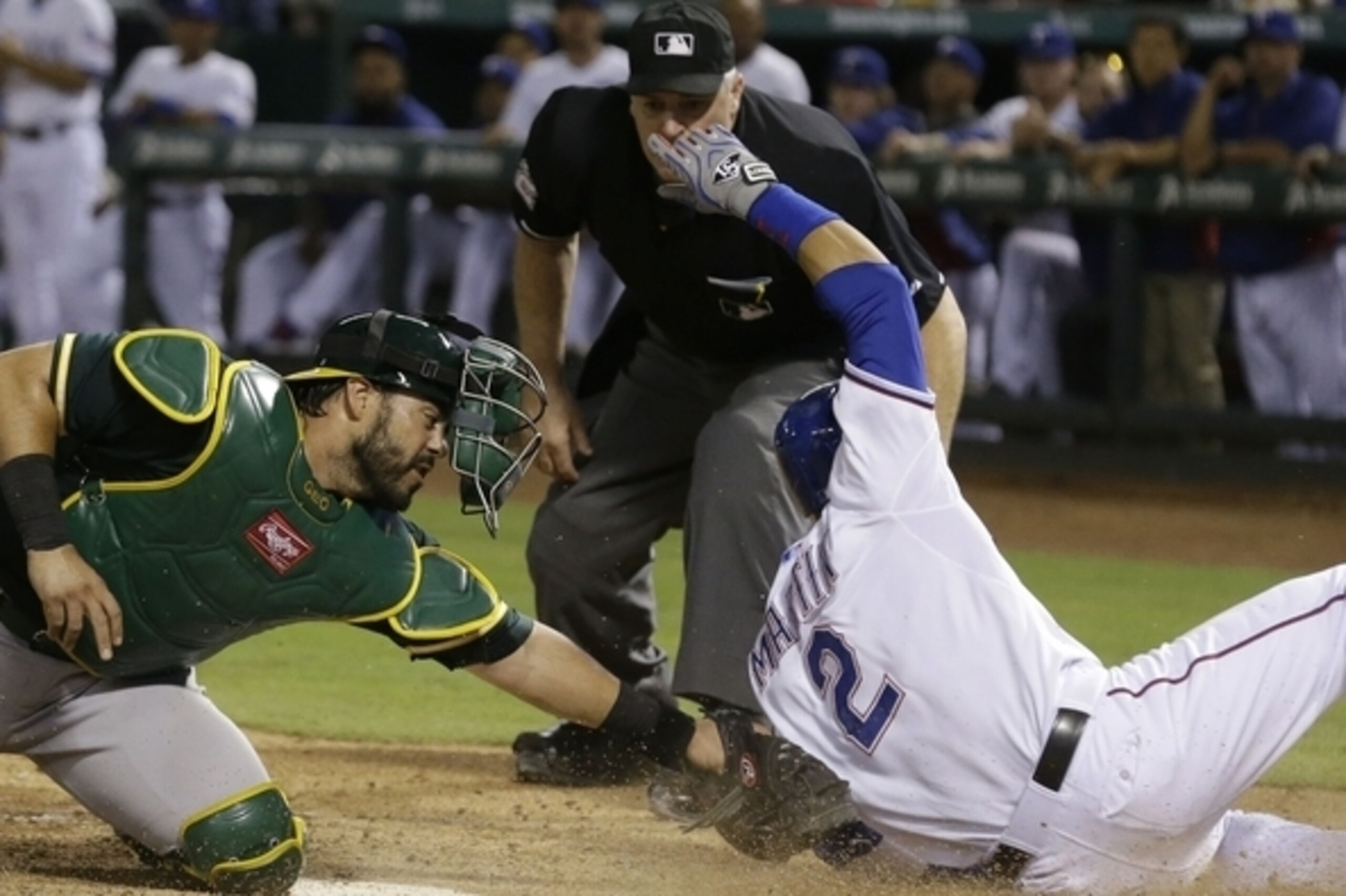 Geovany Soto attempts the swipe tag on a play at the plate against the Rangers on Sept. 26.