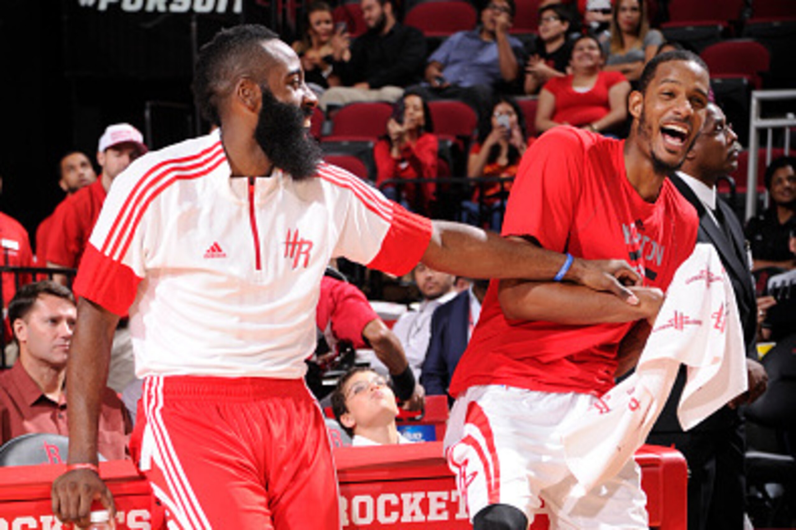 HOUSTON, TX - OCTOBER 9:  James Harden #13 and Trevor Ariza #1 of the Houston Rockets have a laugh during the game against the Memphis Grizzlies on October 9, 2014 at the Toyota Center in Houston, Texas. NOTE TO USER: User expressly acknowledges and agree
