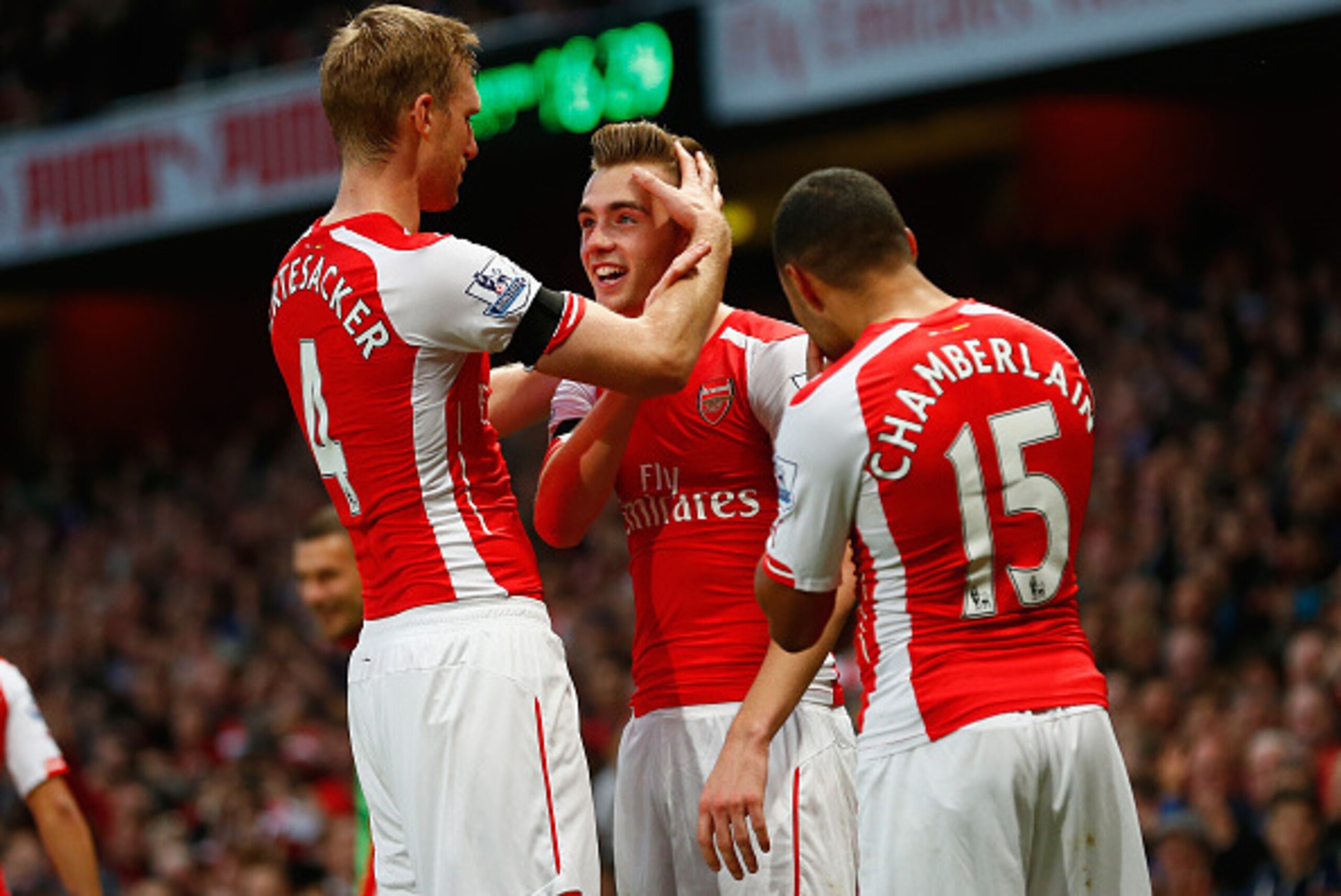 LONDON, ENGLAND - NOVEMBER 01: Calum Chambers of Arsenal celebrates scoring the second goal for Arsenal with Per Mertesacker of Arsenal and Alex Oxlade-Chamberlain of Arsenal during the Barclays Premier League match between Arsenal and Burnley at Emirat LONDON, ENGLAND - NOVEMBER 01: Calum Chambers of Arsenal celebrates scoring the second goal for Arsenal with Per Mertesacker of Arsenal and Alex Oxlade-Chamberlain of Arsenal during the Barclays Premier League match between Arsenal and Burnley at Emirat